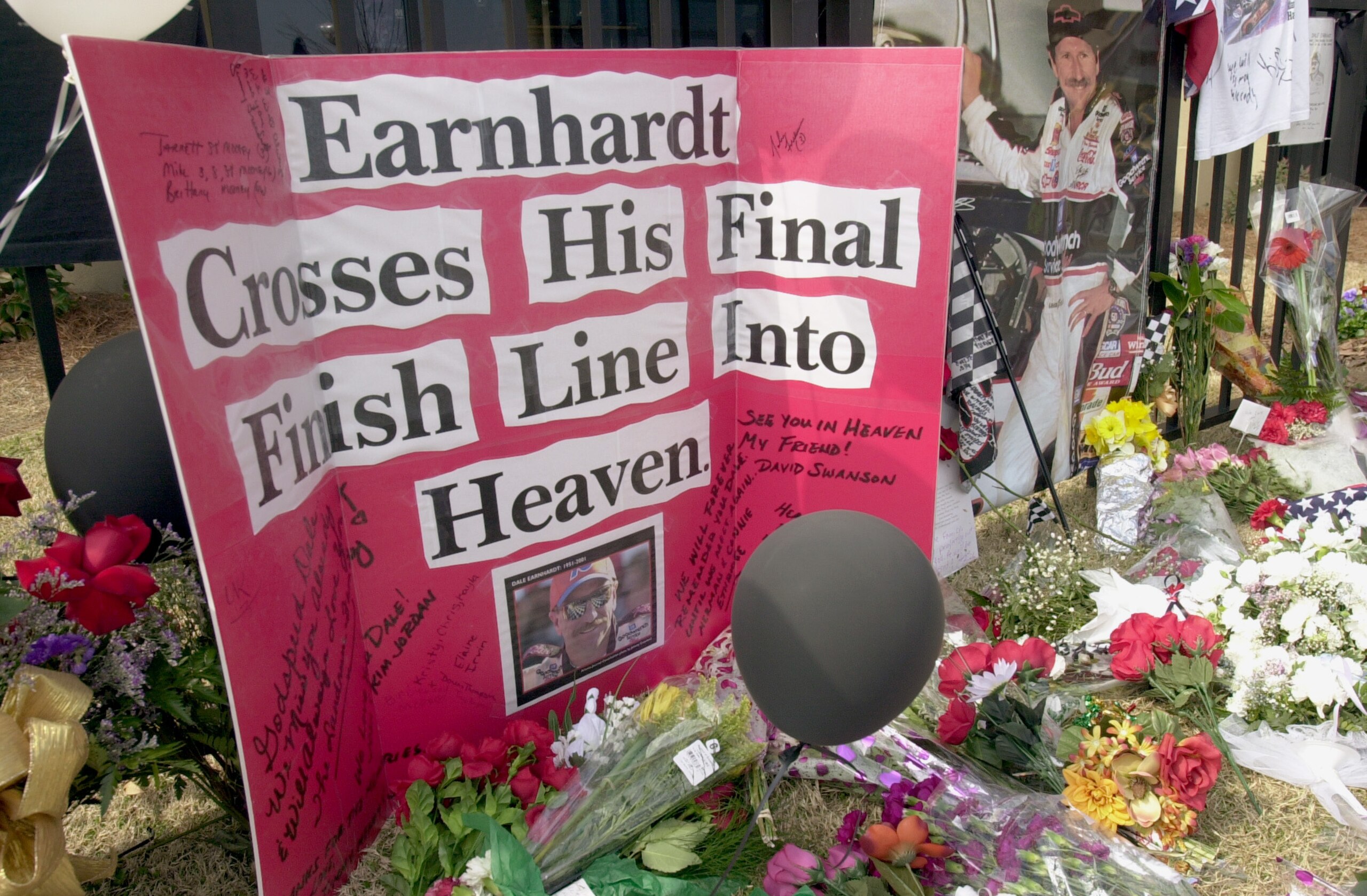 385860 10: A homemade card sits among flowers at at a makeshift memorial for NASCAR driver Dale Earnhardt, February 21, 2001 at Atlanta Motor Speedway in Hampton, Georgia. Earnhardt was killed February 18, 2001 in a crash on the final lap of the Daytona 5