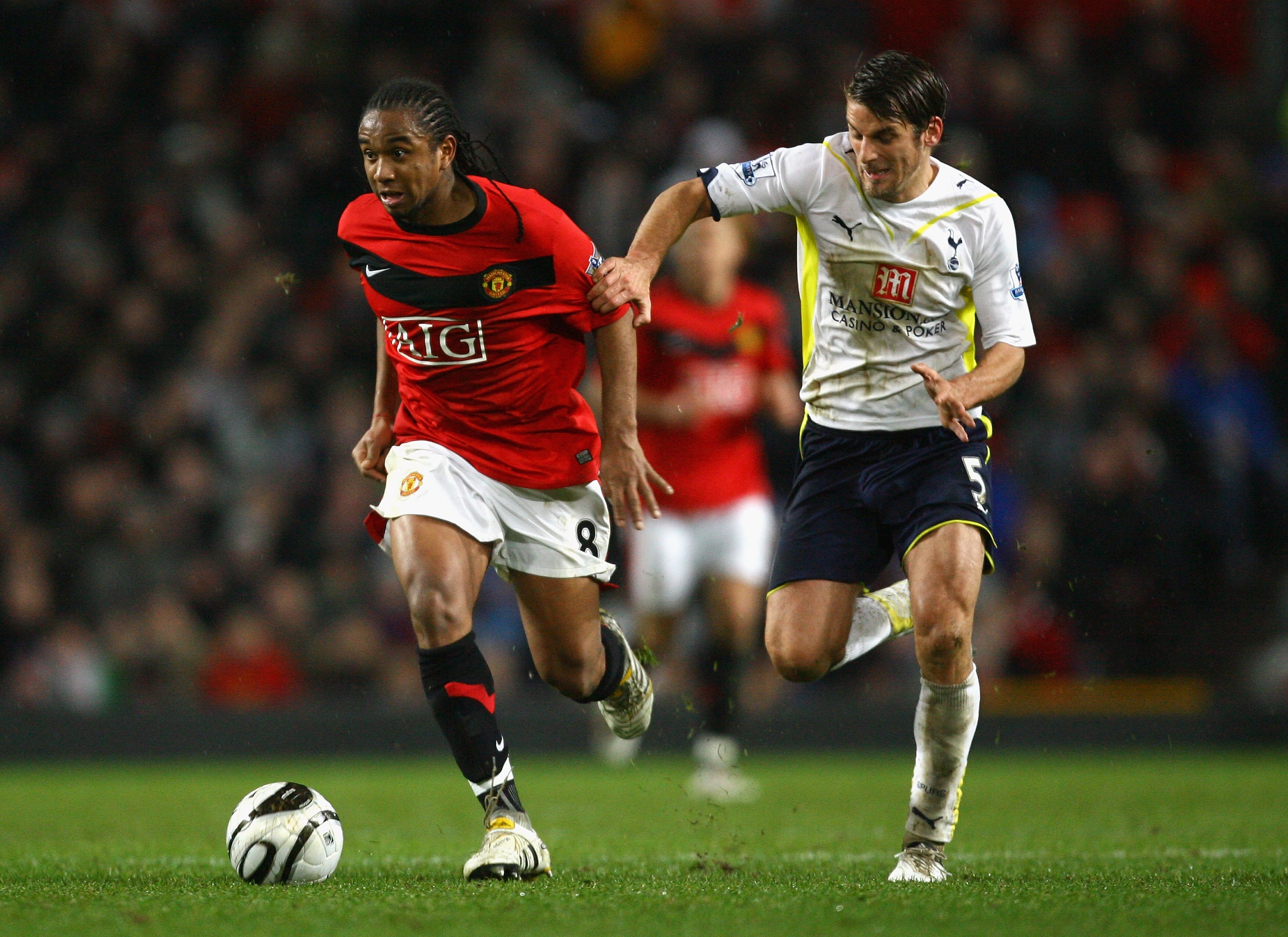 MANCHESTER, ENGLAND - DECEMBER 01:  David Bentley of Tottenham Hotspur challenges Anderson of Manchester United during the Carling Cup Quarter Final match between Manchester United and Tottenham Hotspur at Old Trafford on December 1, 2009 in Manchester, E