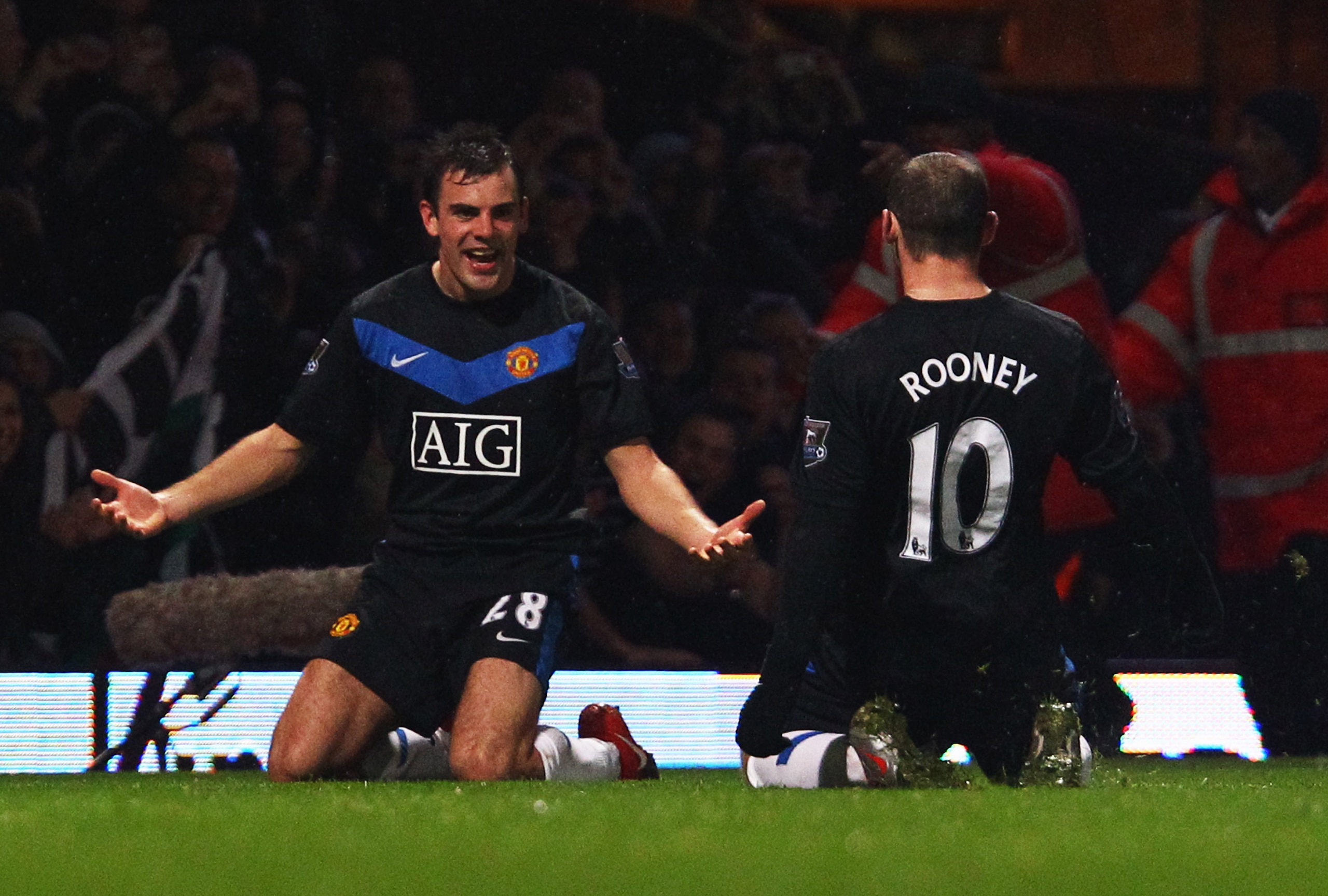 LONDON, ENGLAND - DECEMBER 05:  Darron Gibson of Manchester United celebrates with team mate Wayne Rooney (10) as he scores their second goal during the Barclays Premier League match between West Ham United and Manchester United at Upton Park on December