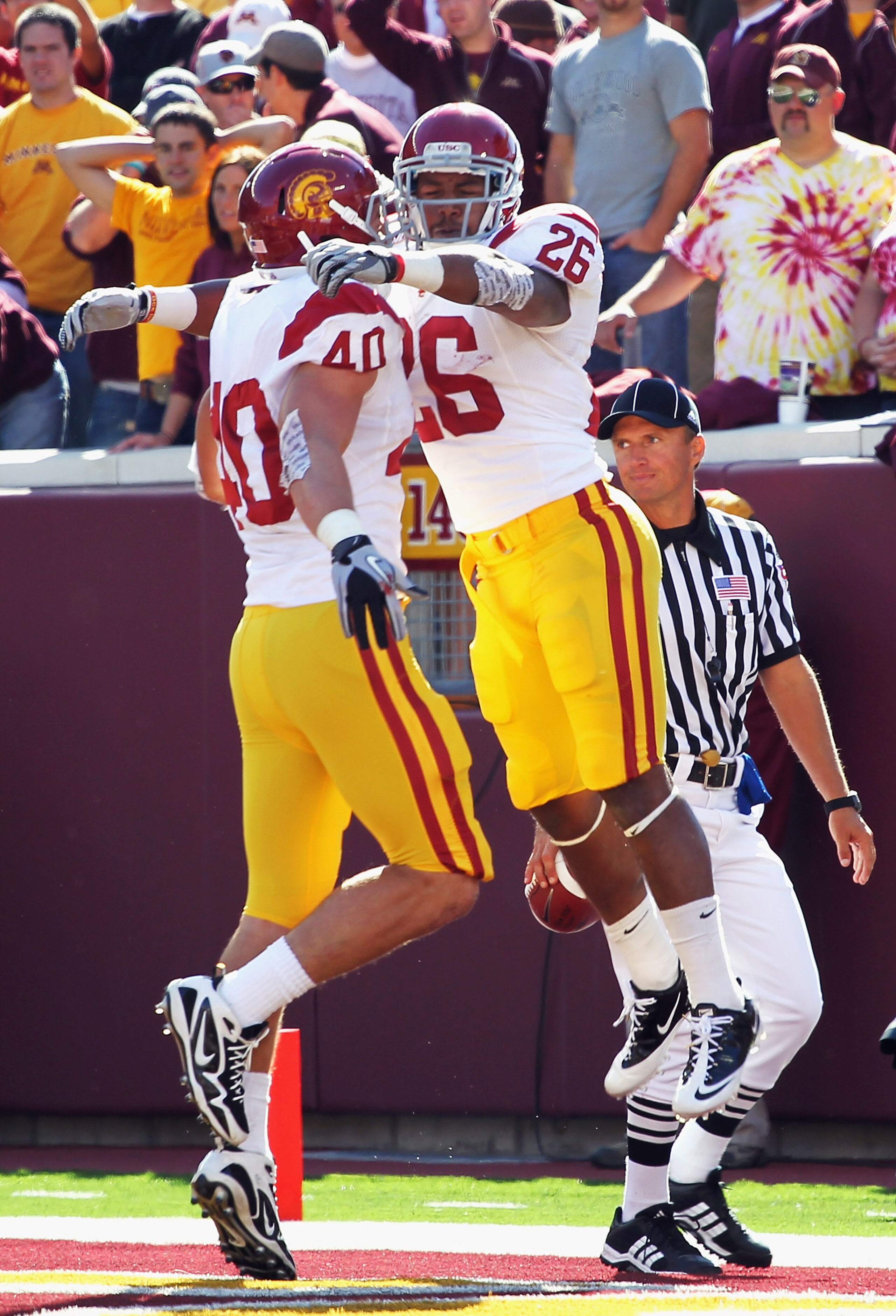 MINNEAPOLIS - SEPTEMBER 18:  Running back Marc Tyler #26 of the USC Trojans celebrates with Rhett Ellison #40 after scoring a touchdown during the first half of the game against the Minnesota Golden Gophers on September 18, 2010 at TCF Bank Stadium in Min