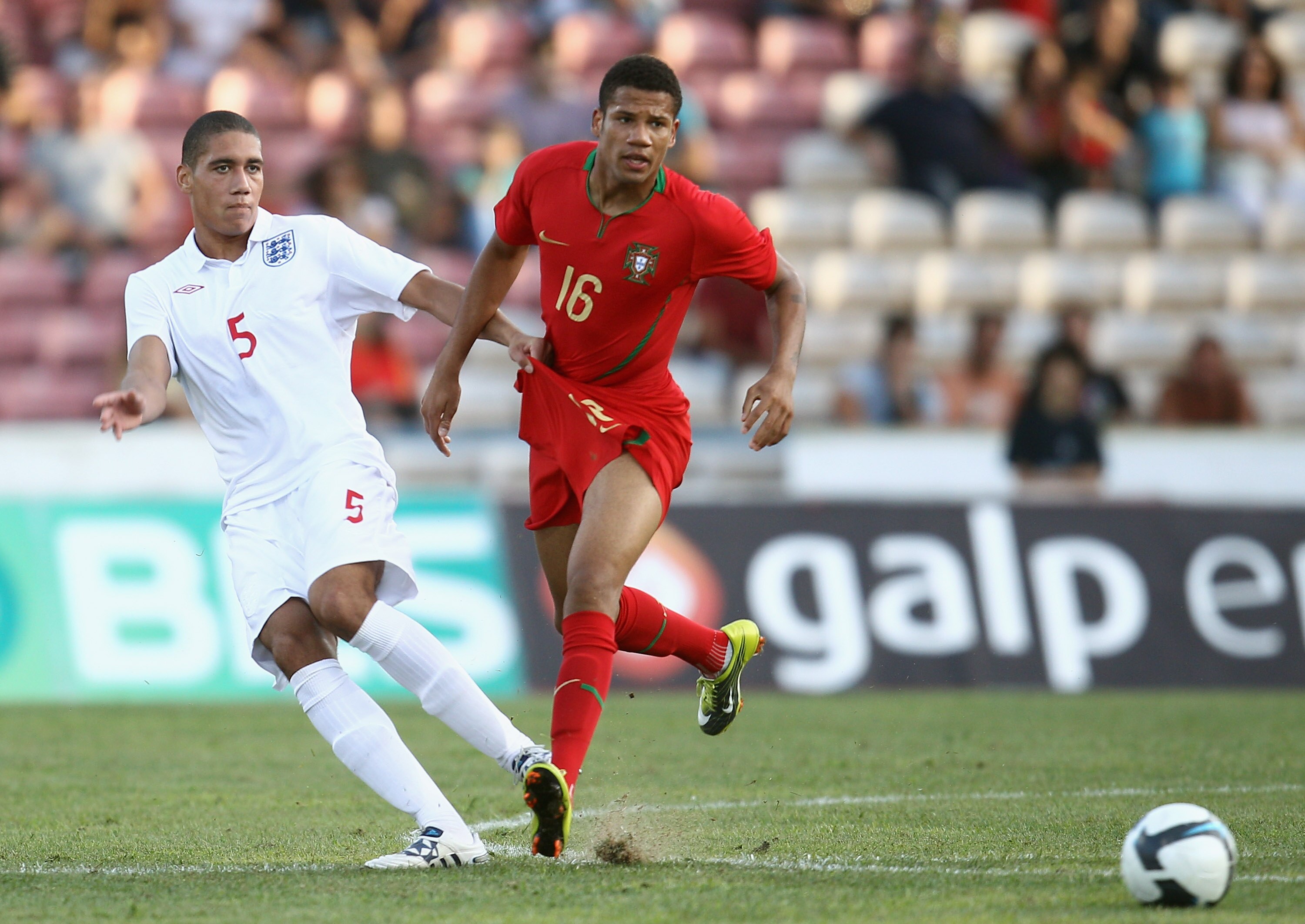 BARCELOS, PORTUGAL - SEPTEMBER 03:  Bebe of Portugal battles for the ball with Chris Samalling of England during the UEFA U21 Championship qualifying match between Portugal U21's and England U21's at Estadio Cidade de Barcelos on September 3, 2010 in Barc