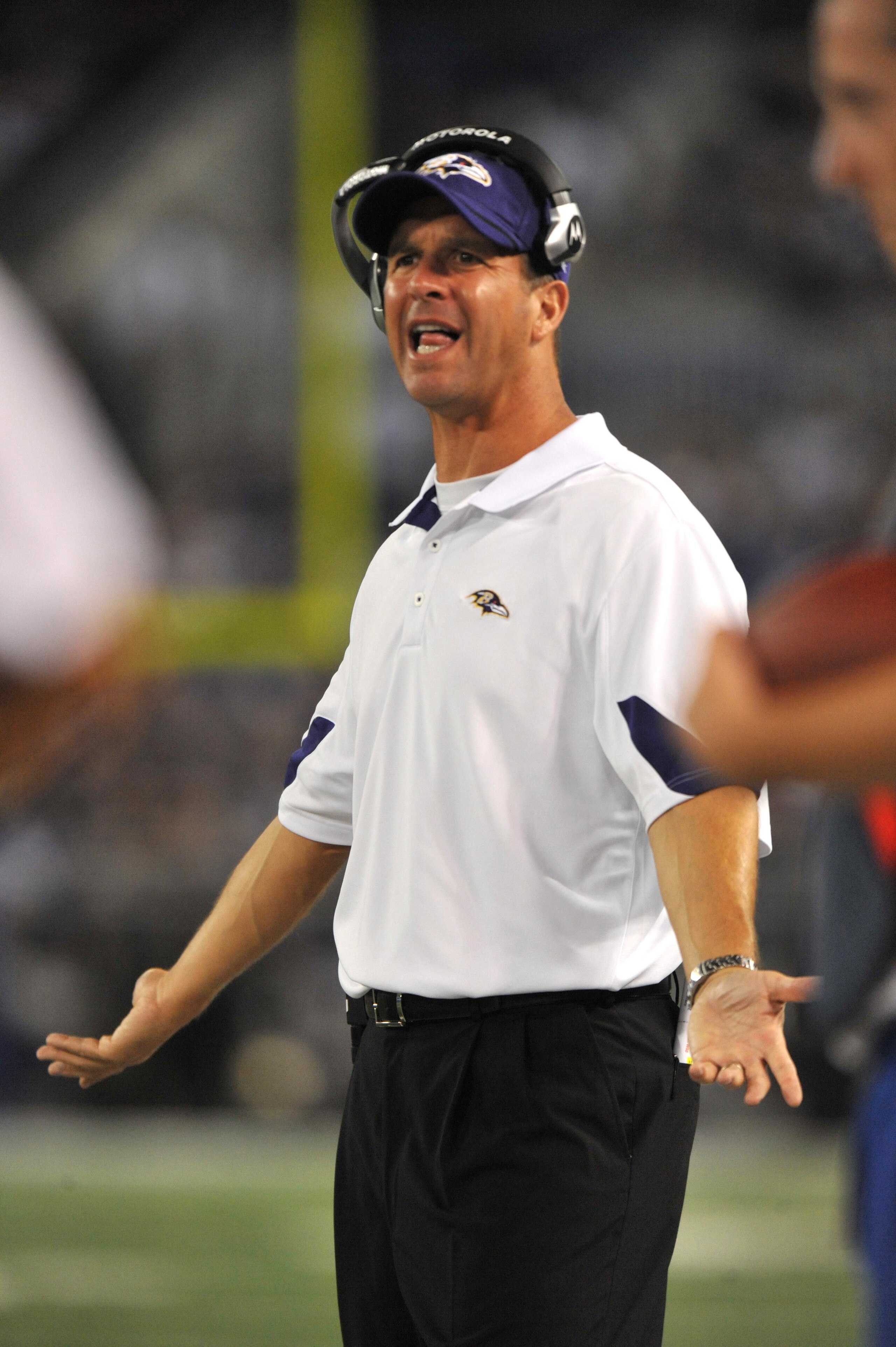 BALTIMORE - AUGUST 28:  Head coach John Harbaugh of the Baltimore Ravens speaks to the referees against the New York Giants in a preseason game at M&T Bank Stadium on August 28, 2010 in Baltimore, Maryland. The Ravens defeated the Giants 24-10. (Photo by