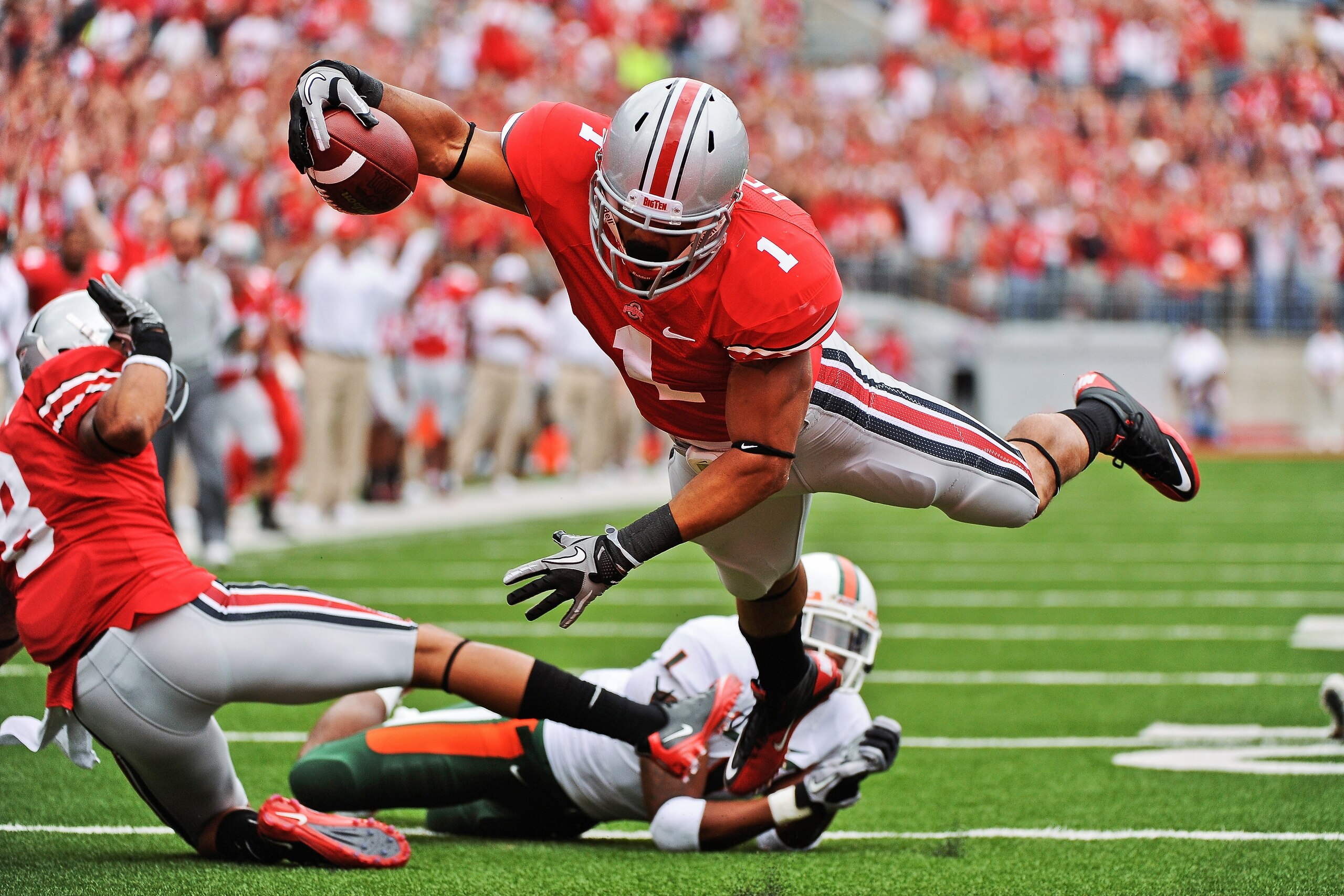 COLUMBUS, OH - SEPTEMBER 11: Dan Herron #1 of the Ohio State Buckeyes runs with the ball against the Miami Hurricanes at Ohio Stadium on September 11, 2010 in Columbus, Ohio. (Photo by Jamie Sabau/Getty Images) COLUMBUS, OH - SEPTEMBER 11: Dan Herron #1 of the Ohio State Buckeyes runs with the ball against the Miami Hurricanes at Ohio Stadium on September 11, 2010 in Columbus, Ohio. (Photo by Jamie Sabau/Getty Images)