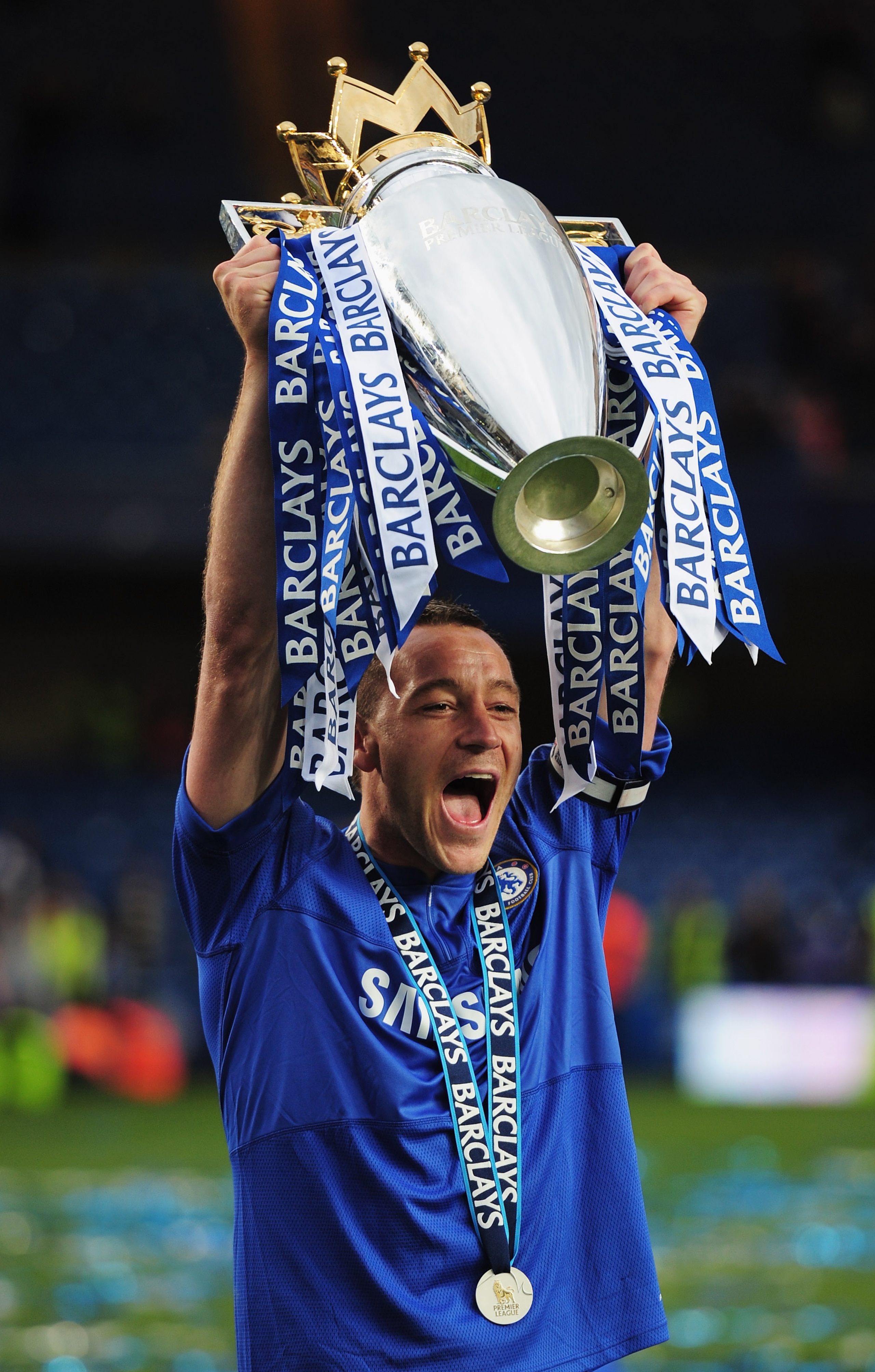 LONDON, ENGLAND - MAY 09:  John Terry of Chelsea celebrates with the trophy after the Barclays Premier League match between Chelsea and Wigan Athletic at Stamford Bridge on May 9, 2010 in London, England. Chelsea won 8-0 to win the title.  (Photo by Shaun