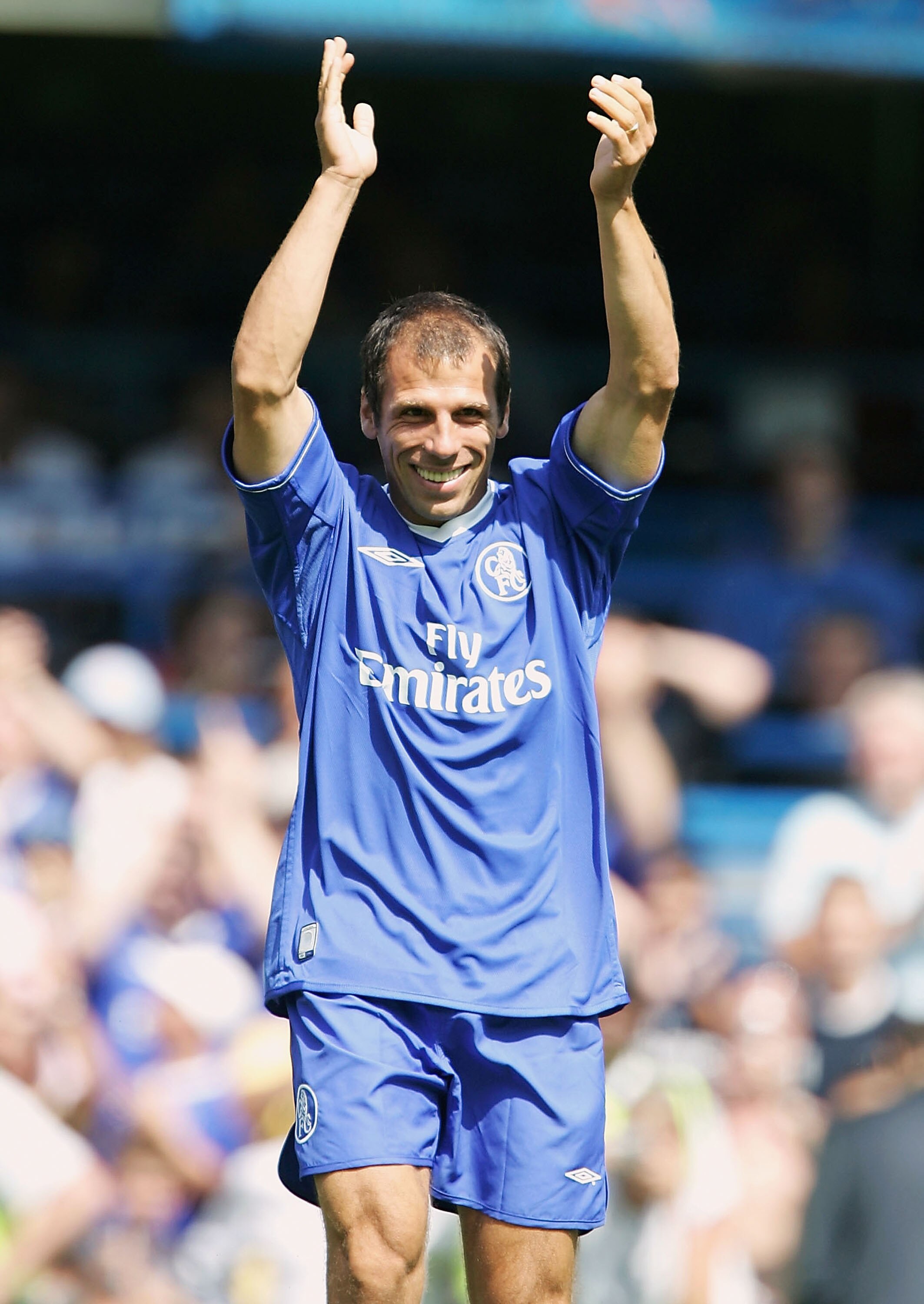 LONDON - AUGUST 8: Gianfranco Zola of Chelsea gets gets a warm receptian during a Tribute match for him between Chelsea and Real Zaragoza at Stamford Bridge on August 8, 2004 in London.  (Photo by Phil Cole/Getty Images)