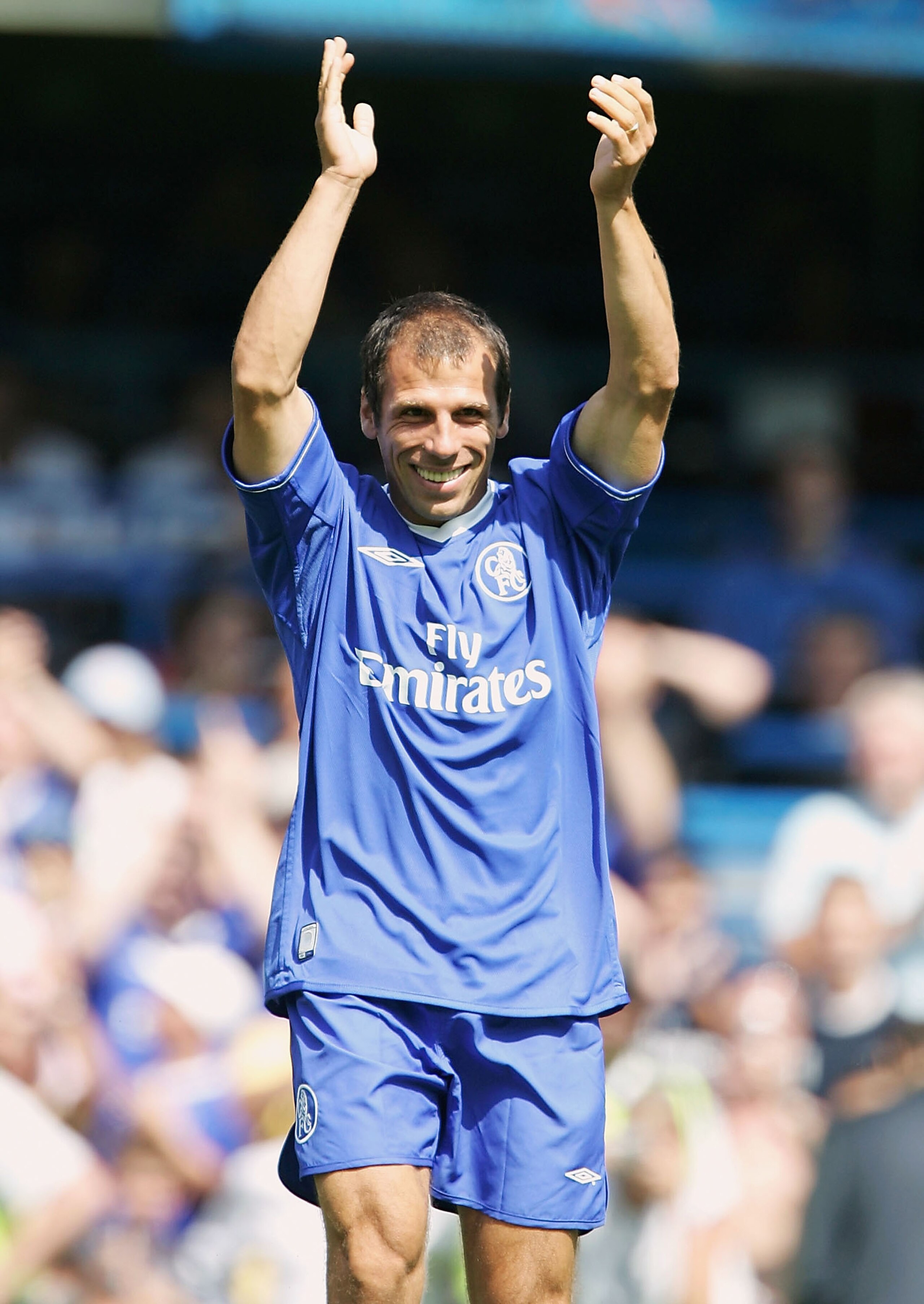 LONDON - AUGUST 8: Gianfranco Zola of Chelsea gets gets a warm receptian during a Tribute match for him between Chelsea and Real Zaragoza at Stamford Bridge on August 8, 2004 in London.  (Photo by Phil Cole/Getty Images)