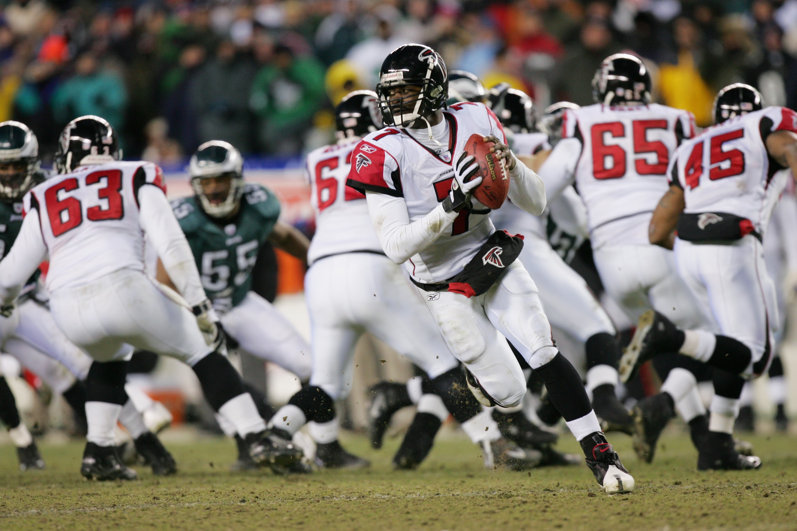 PHILADELPHIA - JANUARY 23:  Michael Vick #7 of the Atlanta Falcons rolls out to pass during the NFC Championship game against the Philadelphia Eagles at Lincoln Financial Field on January 23, 2005 in Philadelphia, Pennsylvannia.  (photo by Ezra Shaw/Getty