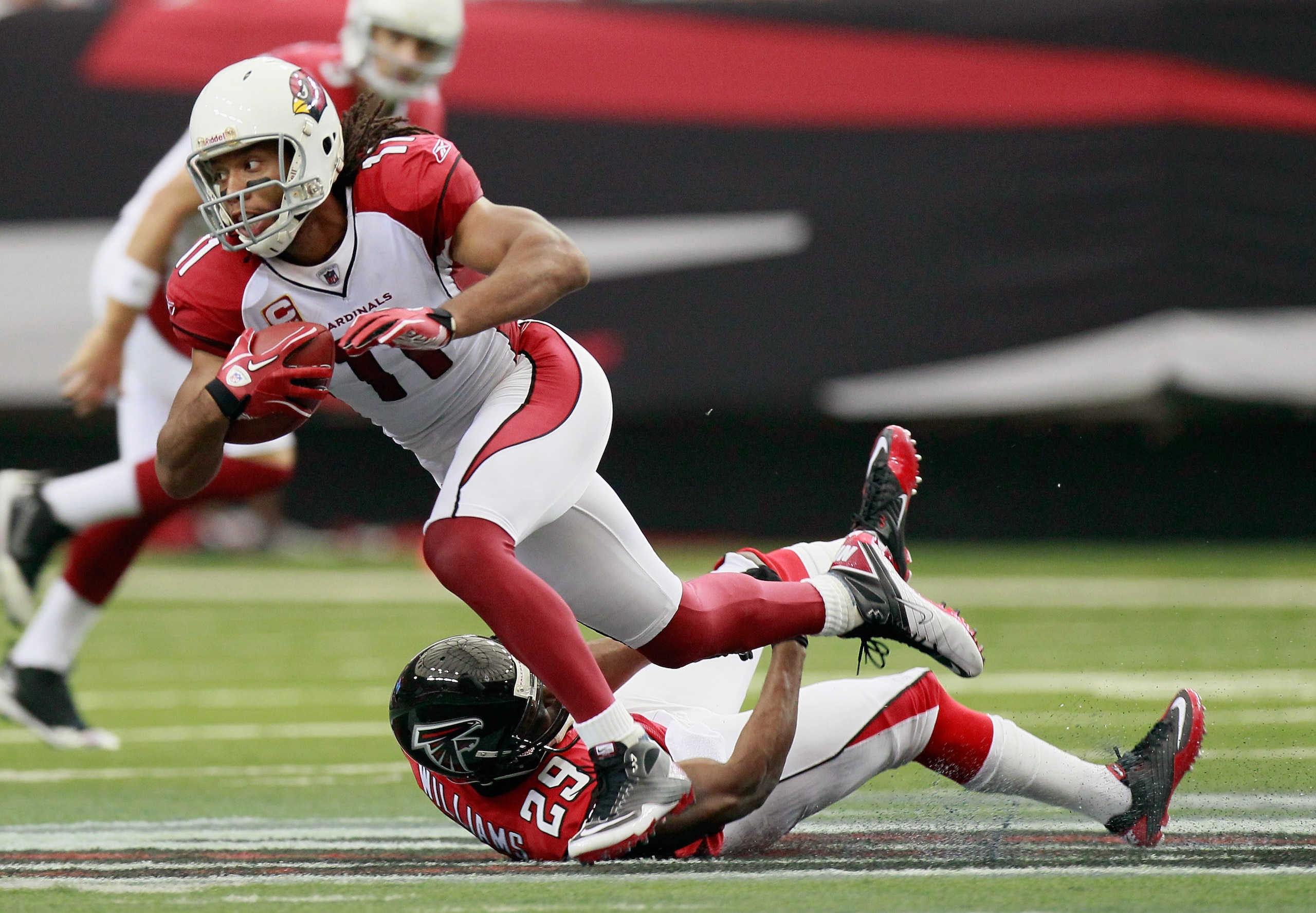 ATLANTA - SEPTEMBER 19: Larry Fitzgerald #11 of the Arizona Cardinals is tackled by Brian Williams #29 of the Atlanta Falcons at Georgia Dome on September 19, 2010 in Atlanta, Georgia. (Photo by Kevin C. Cox/Getty Images) ATLANTA - SEPTEMBER 19: Larry Fitzgerald #11 of the Arizona Cardinals is tackled by Brian Williams #29 of the Atlanta Falcons at Georgia Dome on September 19, 2010 in Atlanta, Georgia. (Photo by Kevin C. Cox/Getty Images)