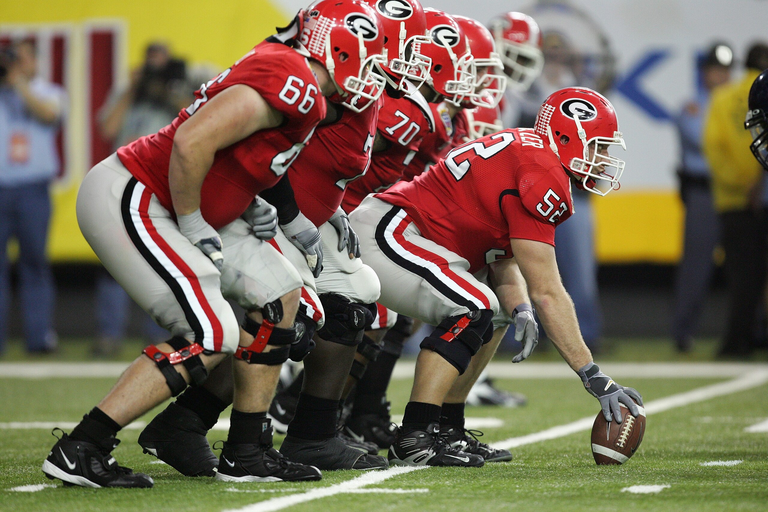 ATLANTA - JANUARY 2: Center Ryan Schnetzer #52 of the Georgia Bulldogs offense lines up at the line of scrimmage against the West Virginia Mountaineers during the Nokia Sugar Bowl game at the Georgia Dome on January 2, 2006 in Atlanta, Georgia. The West ATLANTA - JANUARY 2: Center Ryan Schnetzer #52 of the Georgia Bulldogs offense lines up at the line of scrimmage against the West Virginia Mountaineers during the Nokia Sugar Bowl game at the Georgia Dome on January 2, 2006 in Atlanta, Georgia. The West
