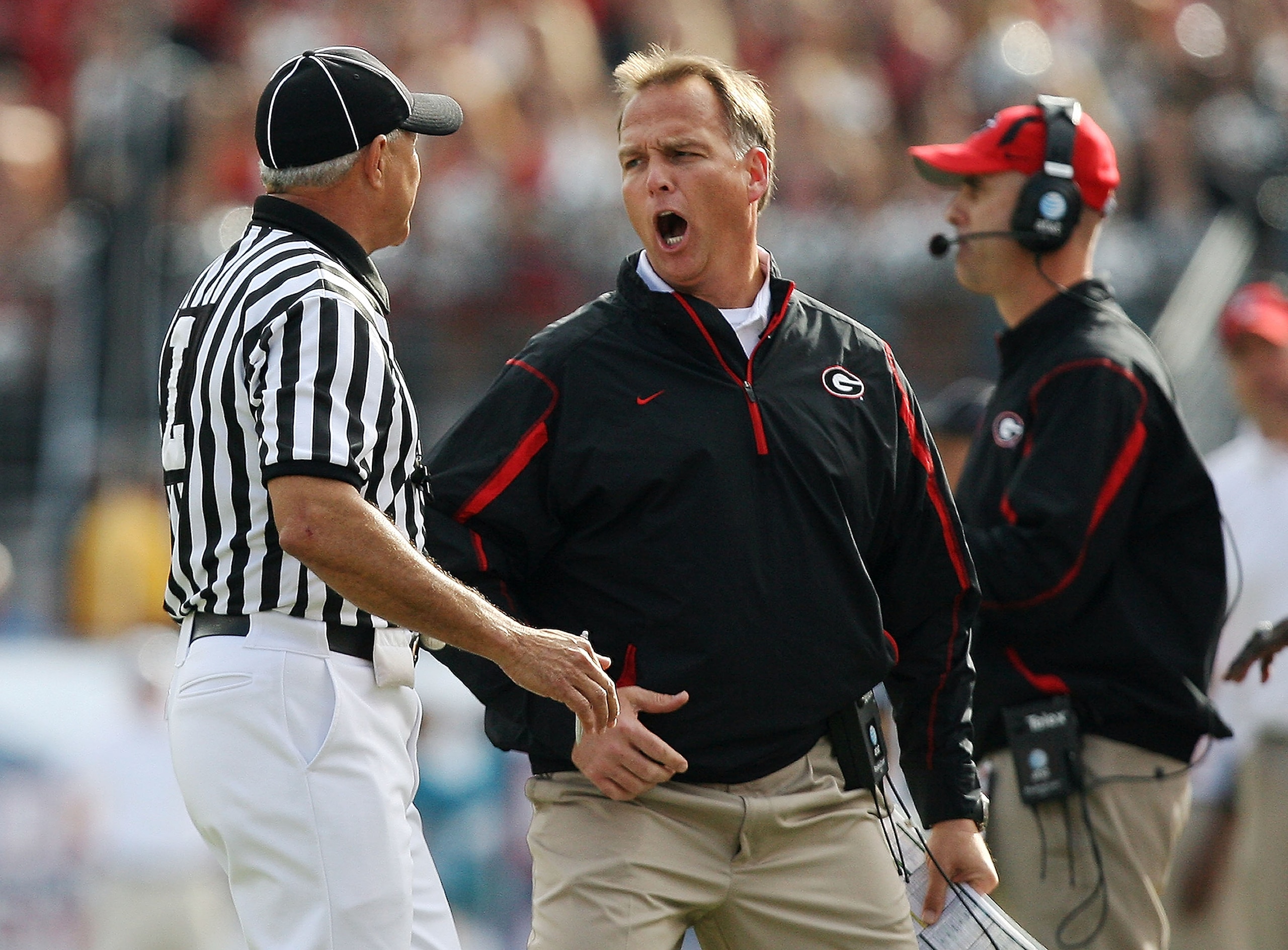 JACKSONVILLE, FL - NOVEMBER 01: Linesman Lane Thomas holds back head coach Mark Richt of the Georgia Bulldogs after a call went against the Bulldogs while taking on the Florida Gators at Jacksonville Municipal Stadium on November 1, 2008 in Jacksonville, JACKSONVILLE, FL - NOVEMBER 01: Linesman Lane Thomas holds back head coach Mark Richt of the Georgia Bulldogs after a call went against the Bulldogs while taking on the Florida Gators at Jacksonville Municipal Stadium on November 1, 2008 in Jacksonville,