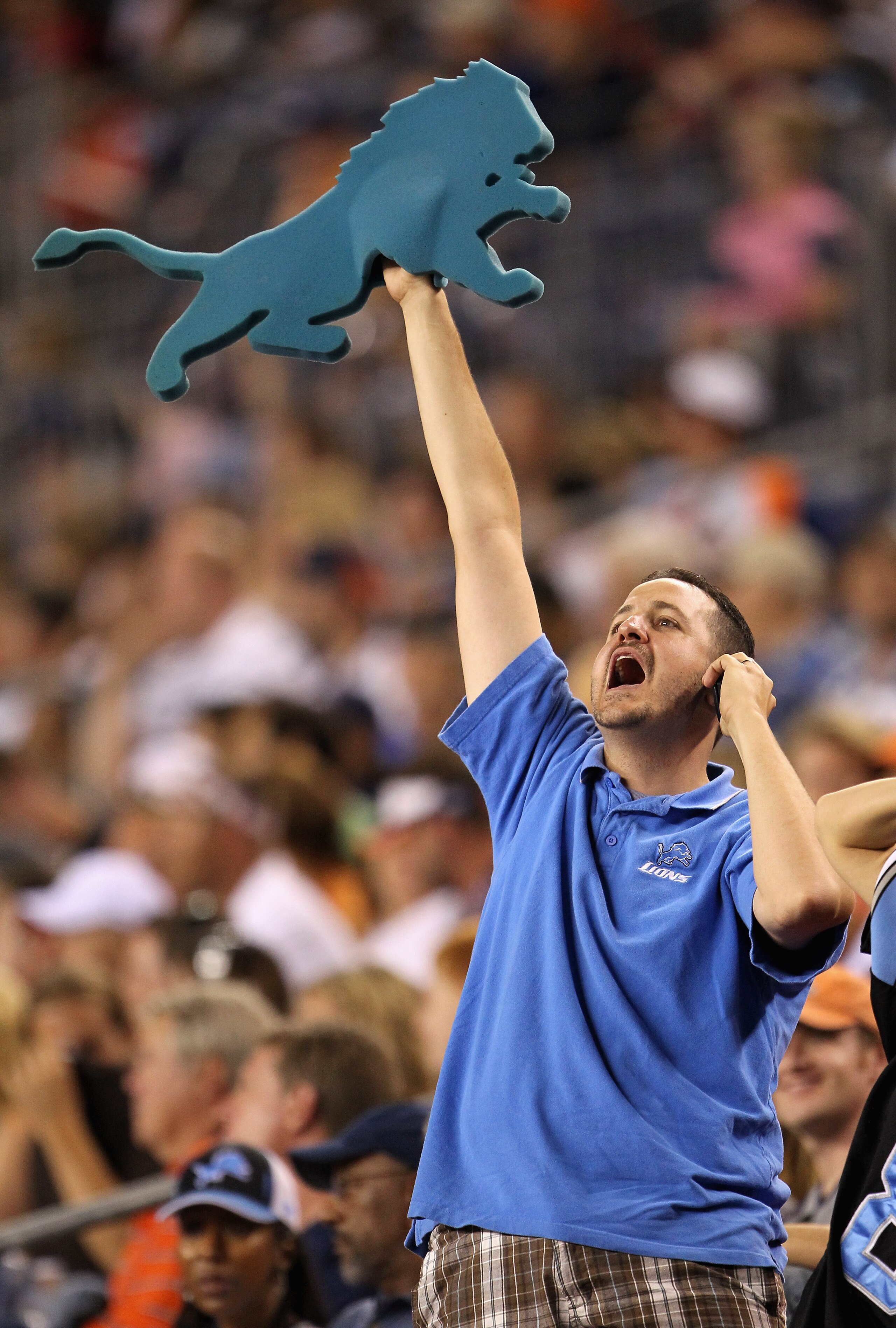 DENVER - AUGUST 21: A Detroit Lions fans celebrates as the Lions face the Denver Broncos during preseason NFL action at INVESCO Field at Mile High on August 21, 2010 in Denver, Colorado. The Lions defeated the Broncos 25-20. (Photo by Doug Pensinger/Get DENVER - AUGUST 21: A Detroit Lions fans celebrates as the Lions face the Denver Broncos during preseason NFL action at INVESCO Field at Mile High on August 21, 2010 in Denver, Colorado. The Lions defeated the Broncos 25-20. (Photo by Doug Pensinger/Get