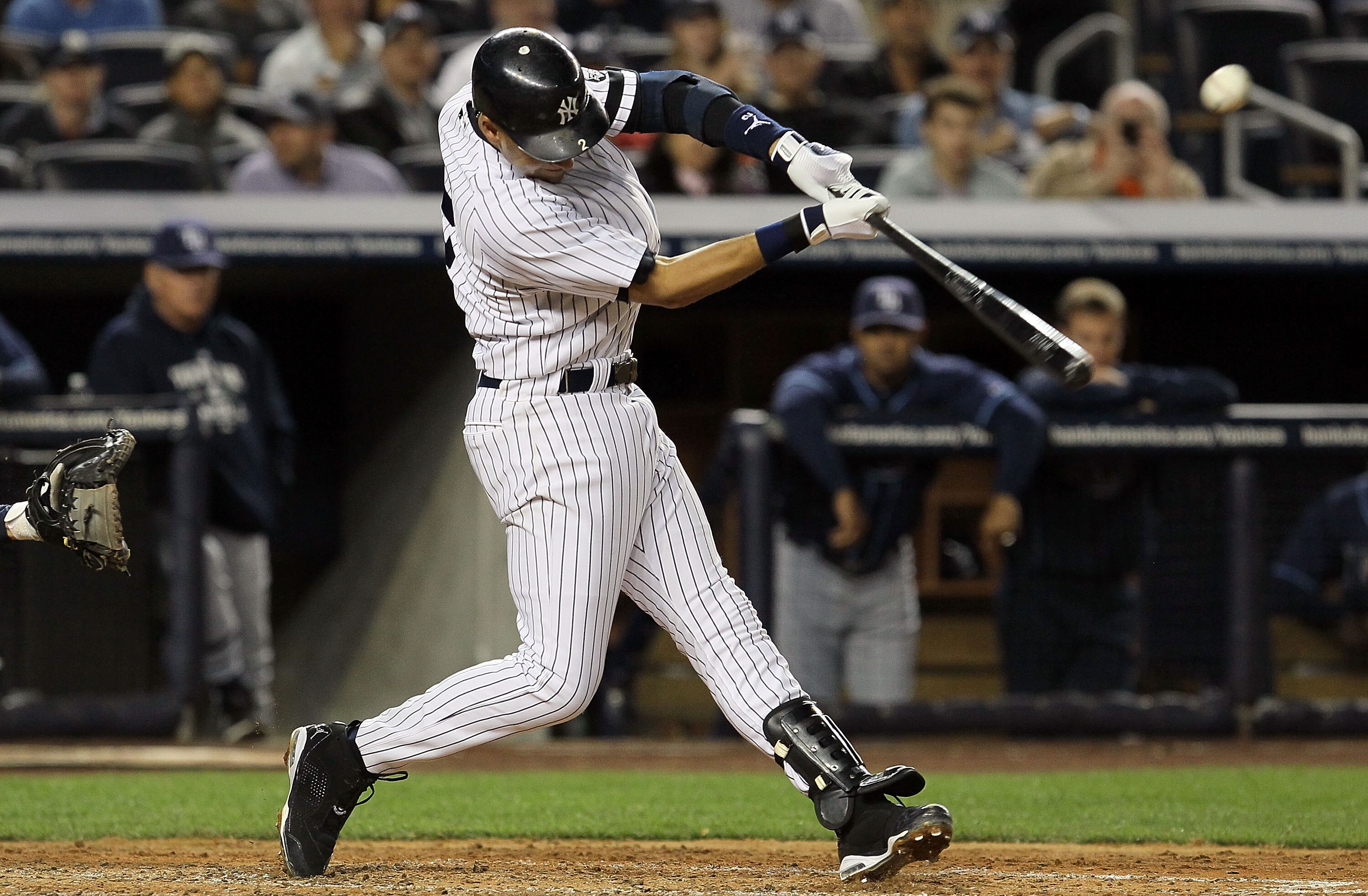 NEW YORK - SEPTEMBER 20:  Derek Jeter #2 of the New York Yankees connects on a fifth inning ground rule double against the Tampa Bay Rays on September 20, 2010 at Yankee Stadium in the Bronx borough of New York City.  (Photo by Jim McIsaac/Getty Images)