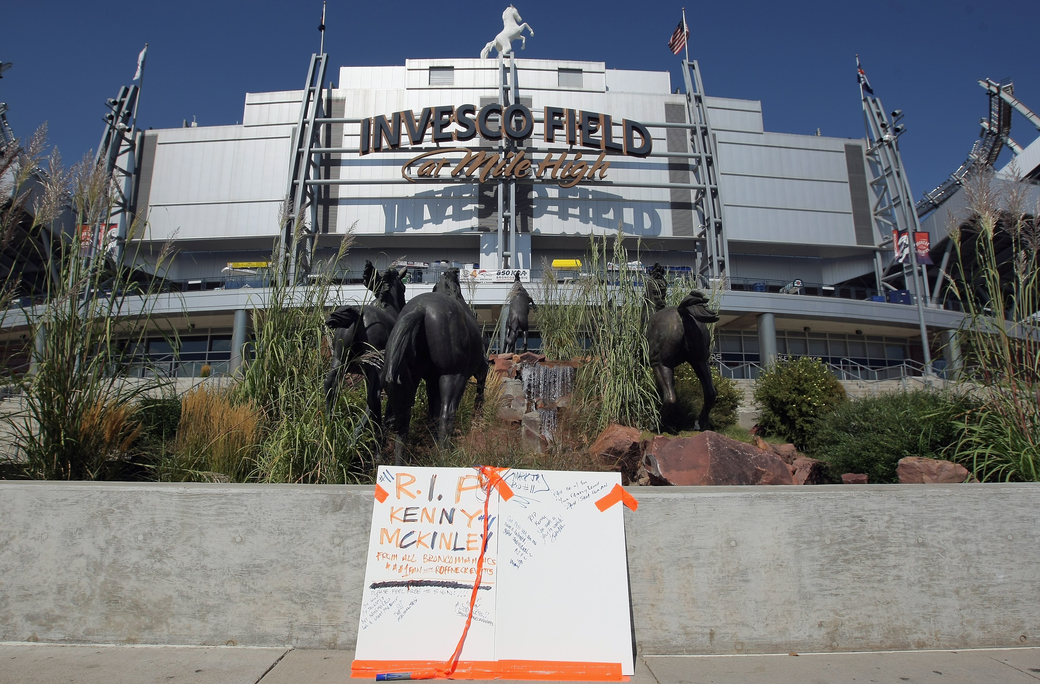 ENGLEWOOD, CO - SEPTEMBER 21:  A poster is placed on the plaza outside stadium for fans to sign in memory of Denver Bronco wide receiver Kenny McKinley at Invesco Field at Mile High on September 21, 2010 in Denver, Colorado. McKinley, 23, was found dead i