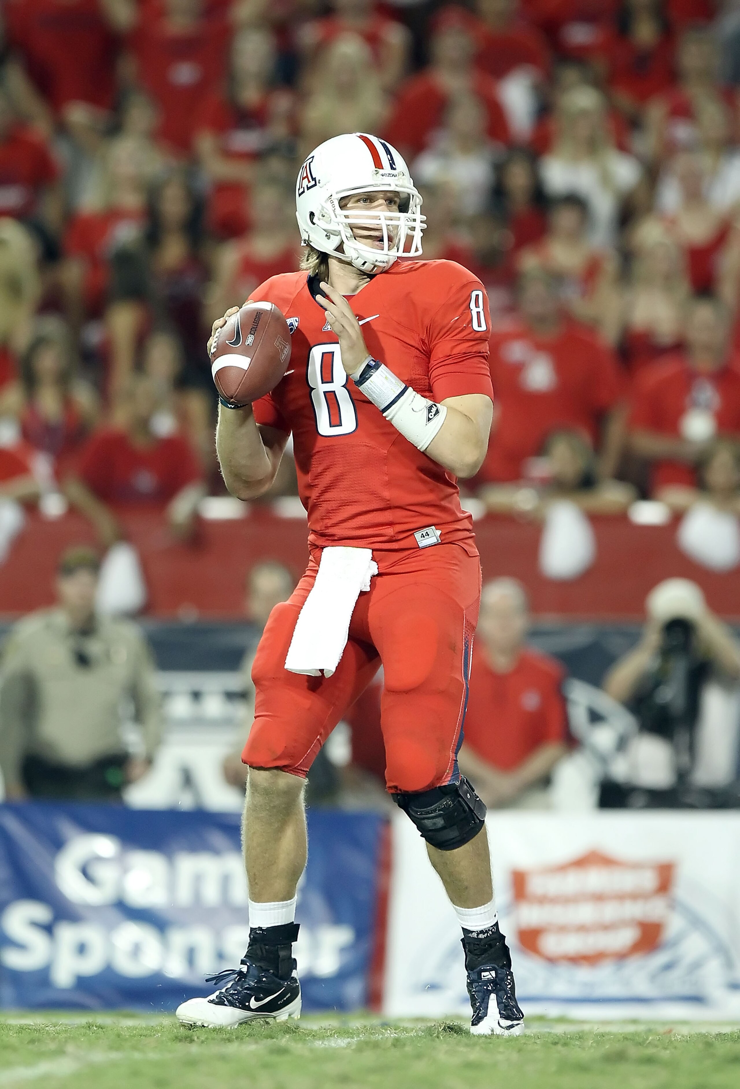 TUCSON, AZ - SEPTEMBER 18:  Quarterback Nick Foles #8 of the Arizona Wildcats drops back to pass during the college football game against the Iowa Hawkeyes at Arizona Stadium on September 18, 2010 in Tucson, Arizona. The Wildcats defeated the Hawkeyes 34-