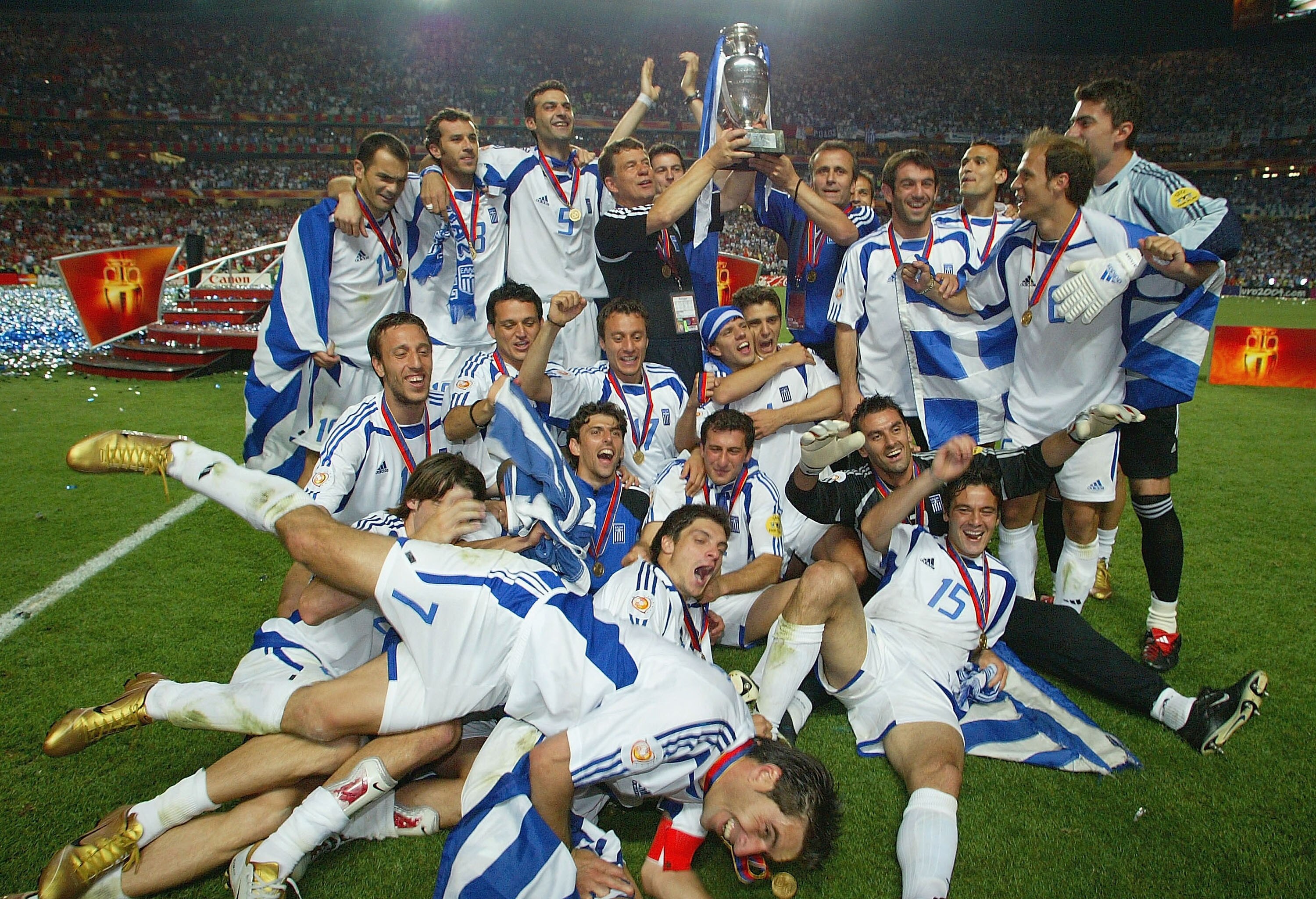 LISBON, PORTUGAL - JULY 4:  Greece celebrate with the trophy after winning the UEFA Euro 2004, Final match between Portugal and Greece at the Luz Stadium on July 4, 2004 in Lisbon, Portugal. (Photo by Ben Radford/Getty Images)