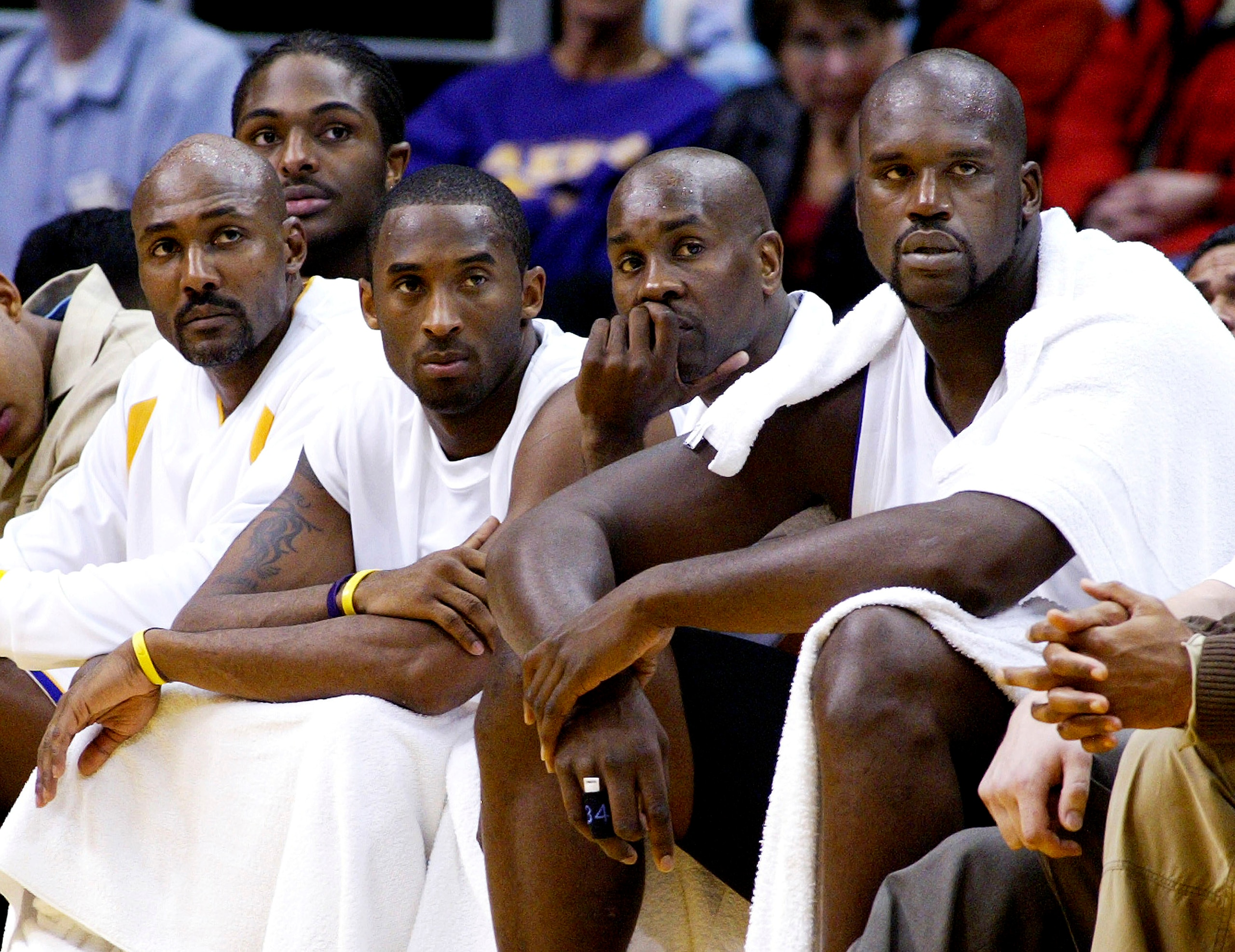LOS ANGELES, CA - NOVEMBER 2: (L-R) Los Angeles Lakers players Karl Malone, Kobe Bryant, Gary Payton and Shaquille O'Neal watch from the bench during the game against the Golden State Warriors on November 2, 2003 at Staples Center in Los Angeles, Californ