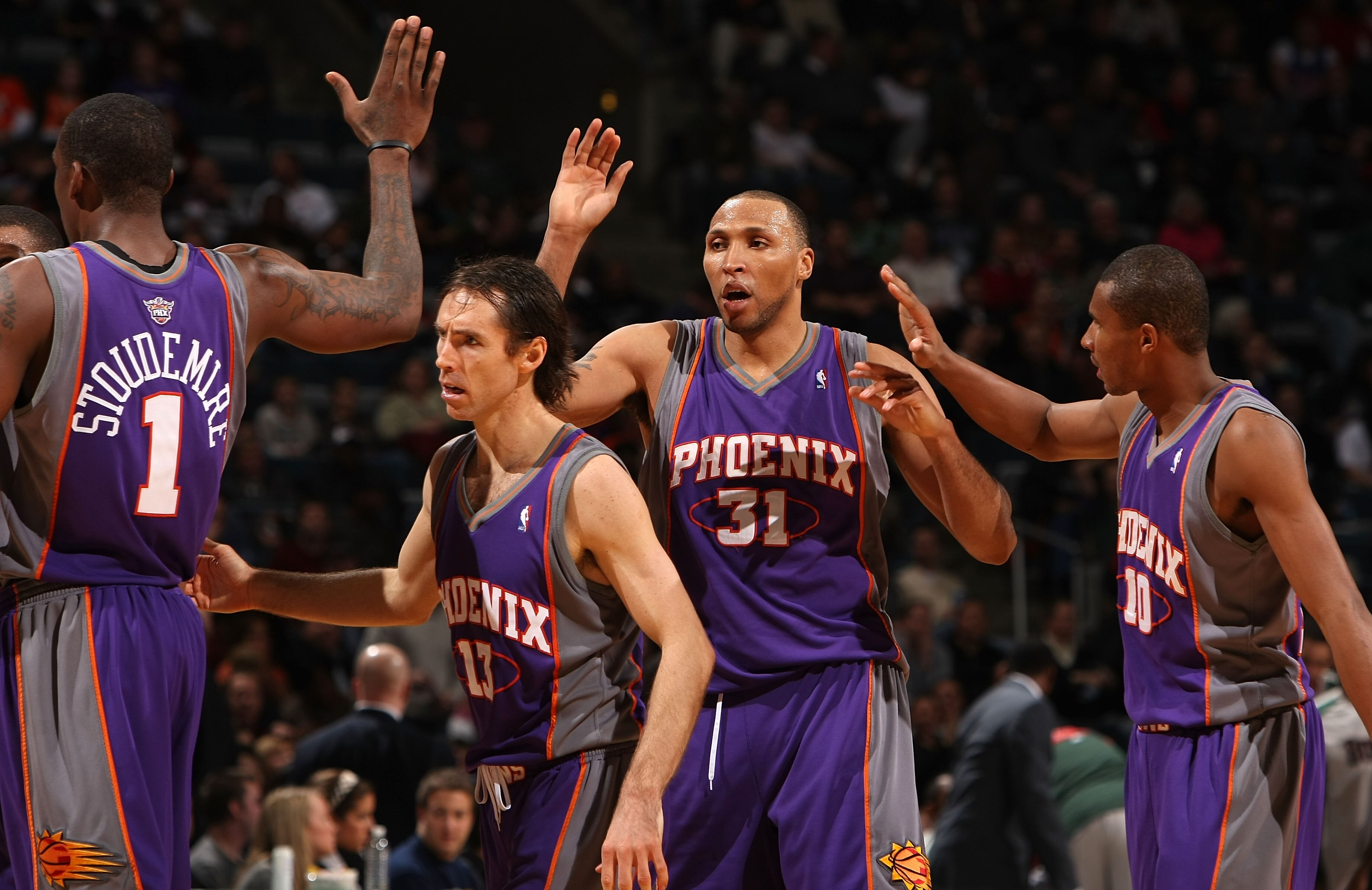 MILWAUKEE - JANUARY 22:  (L-R) Amare Stoudemire #1, Steve Nash #13, Shawn Marion #31 and Leandro Barbosa #10 of the Phoenix Suns celebrate late in the game against the Milwaukee Bucks at the Bradley Center on January 22, 2008 in Milwaukee, Wisconsin. The
