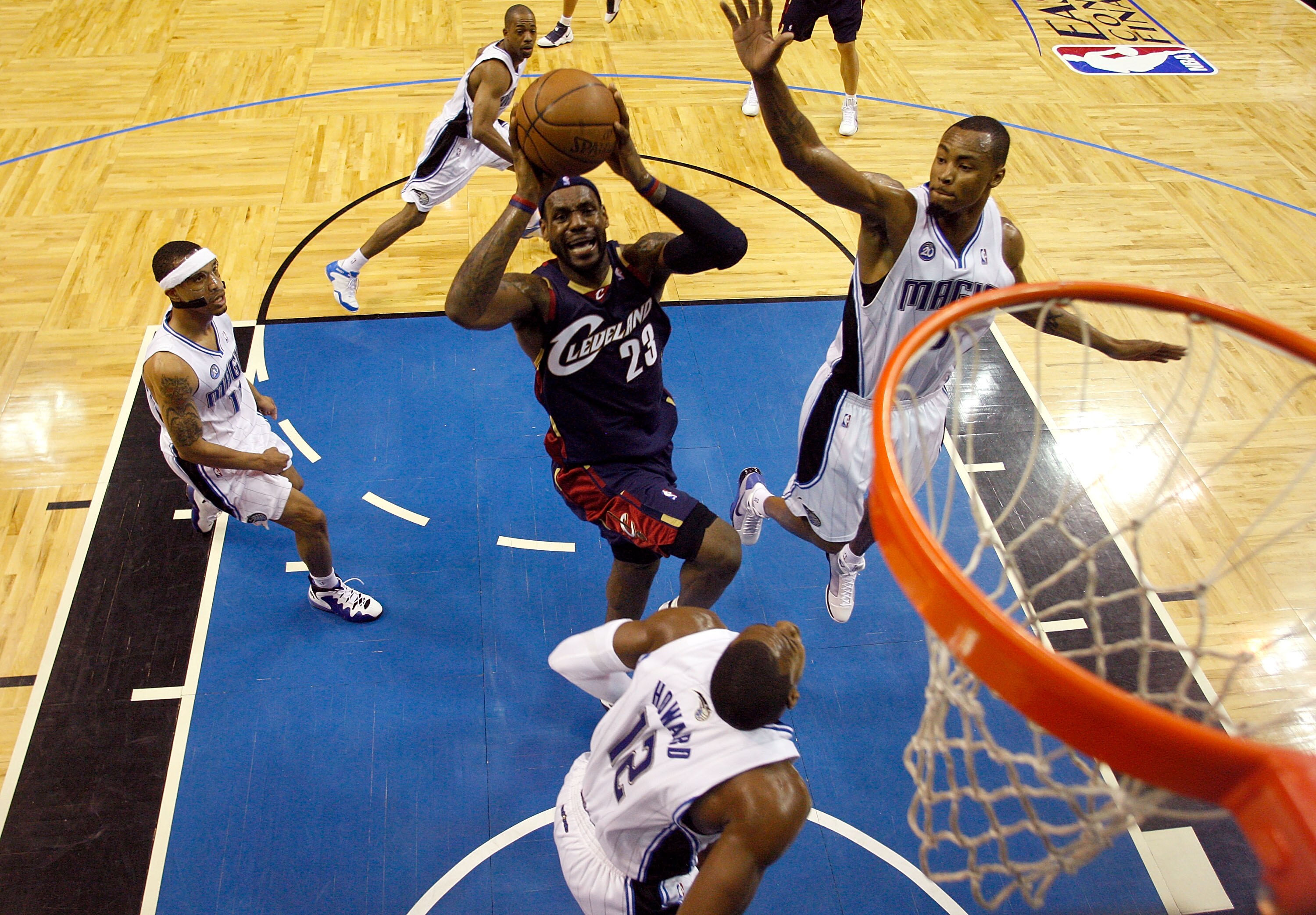 ORLANDO, FL - MAY 30: LeBron James #23 of the Cleveland Cavaliers drives to the hoop against Dwight Howard #12 and Rashard Lewis #9 of the Orlando Magic in Game Six of the Eastern Conference Finals during the 2009 Playoffs at Amway Arena on May 30, 2009 i