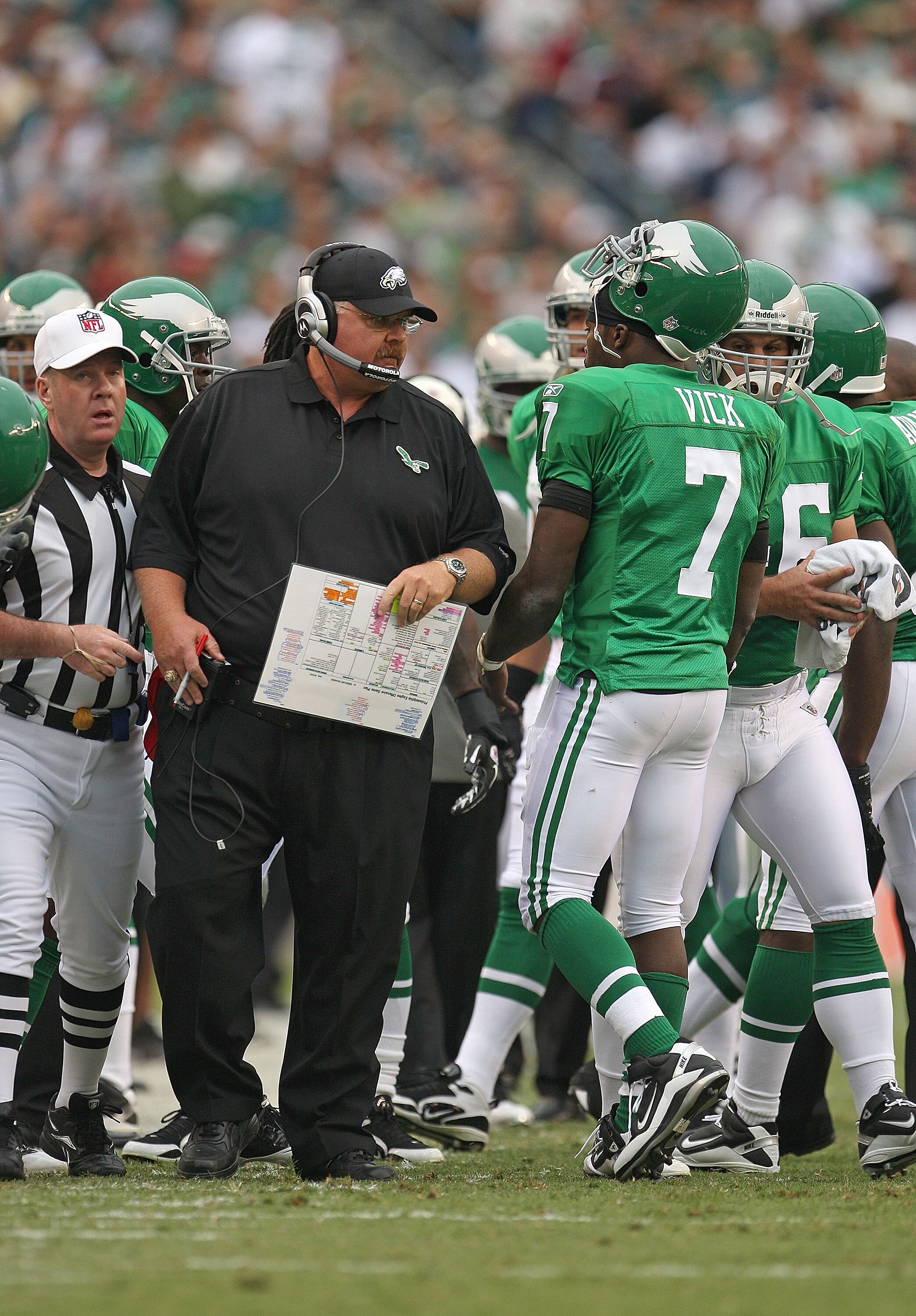 PHILADELPHIA - SEPTEMBER 12:  Michael Vick #7 of the Philadelphia Eagles talks with head coach Andy Reid during a game against the Green Bay Packers at Lincoln Financial Field on September 12, 2010 in Philadelphia, Pennsylvania.  (Photo by Mike Ehrmann/Ge