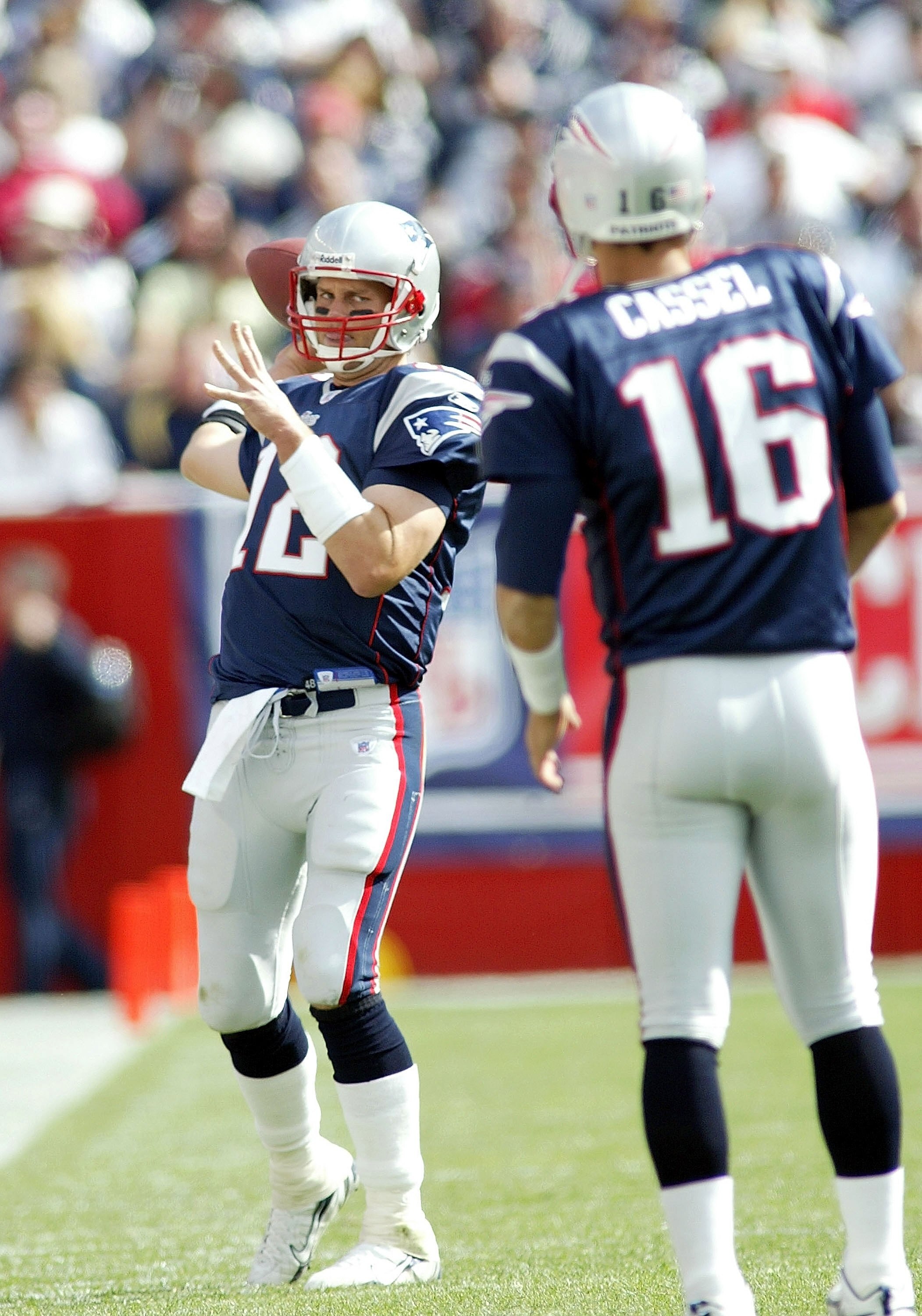 FOXBORO, MA - SEPTEMBER 10:  Tom Brady #12 of the New England Patriots keeps loose by throwing passes to Matt Cassel #16 during a timeout against the Buffalo Bills on September 10, 2006 at Gillette Stadium in Foxboro, Massachusetts. The Patriots defeated