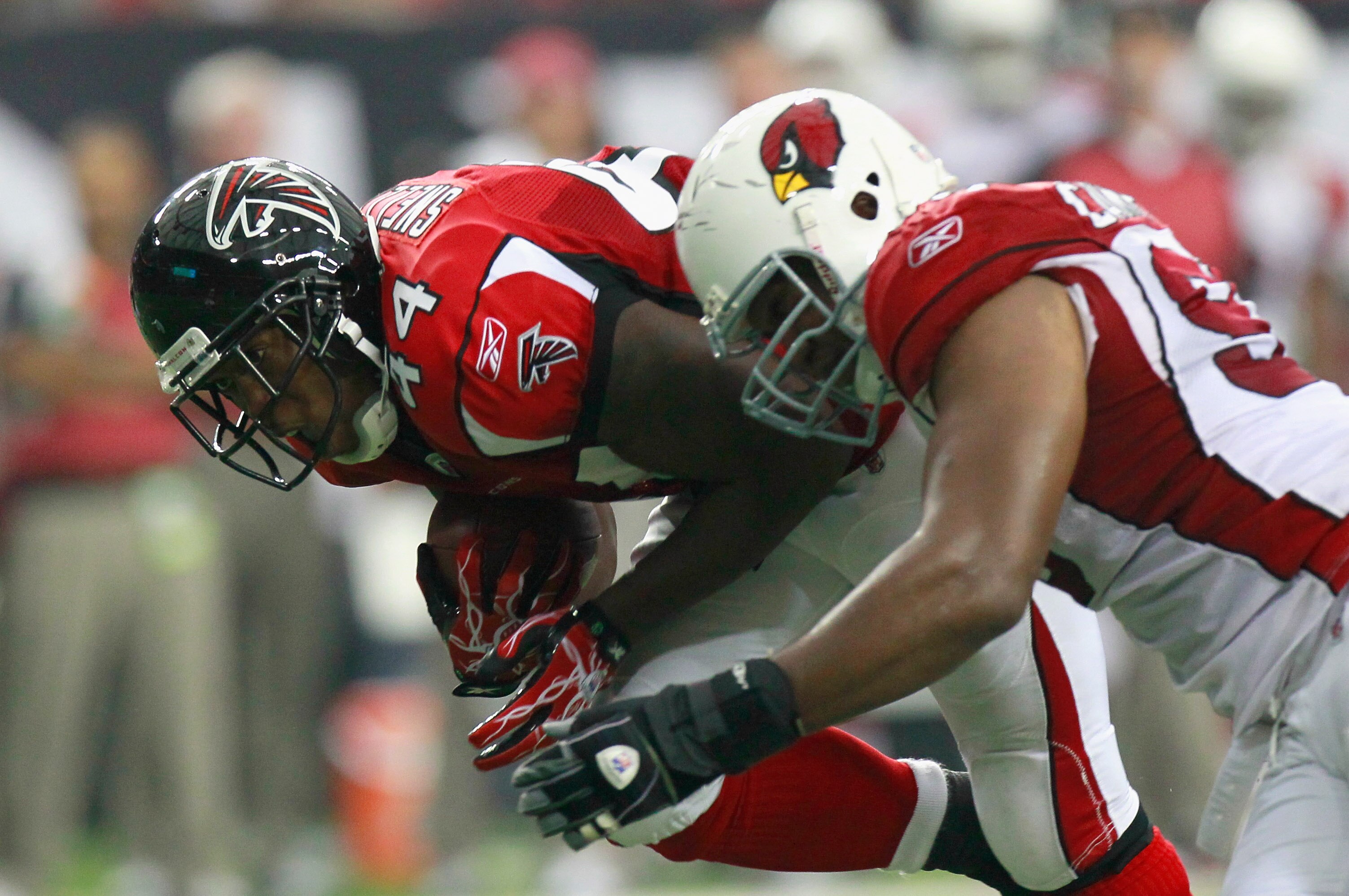 ATLANTA - SEPTEMBER 19:  Jason Snelling #44 of the Atlanta Falcons is tackled by Calais Campbell #93 of the Arizona Cardinals at Georgia Dome on September 19, 2010 in Atlanta, Georgia.  (Photo by Kevin C. Cox/Getty Images)
