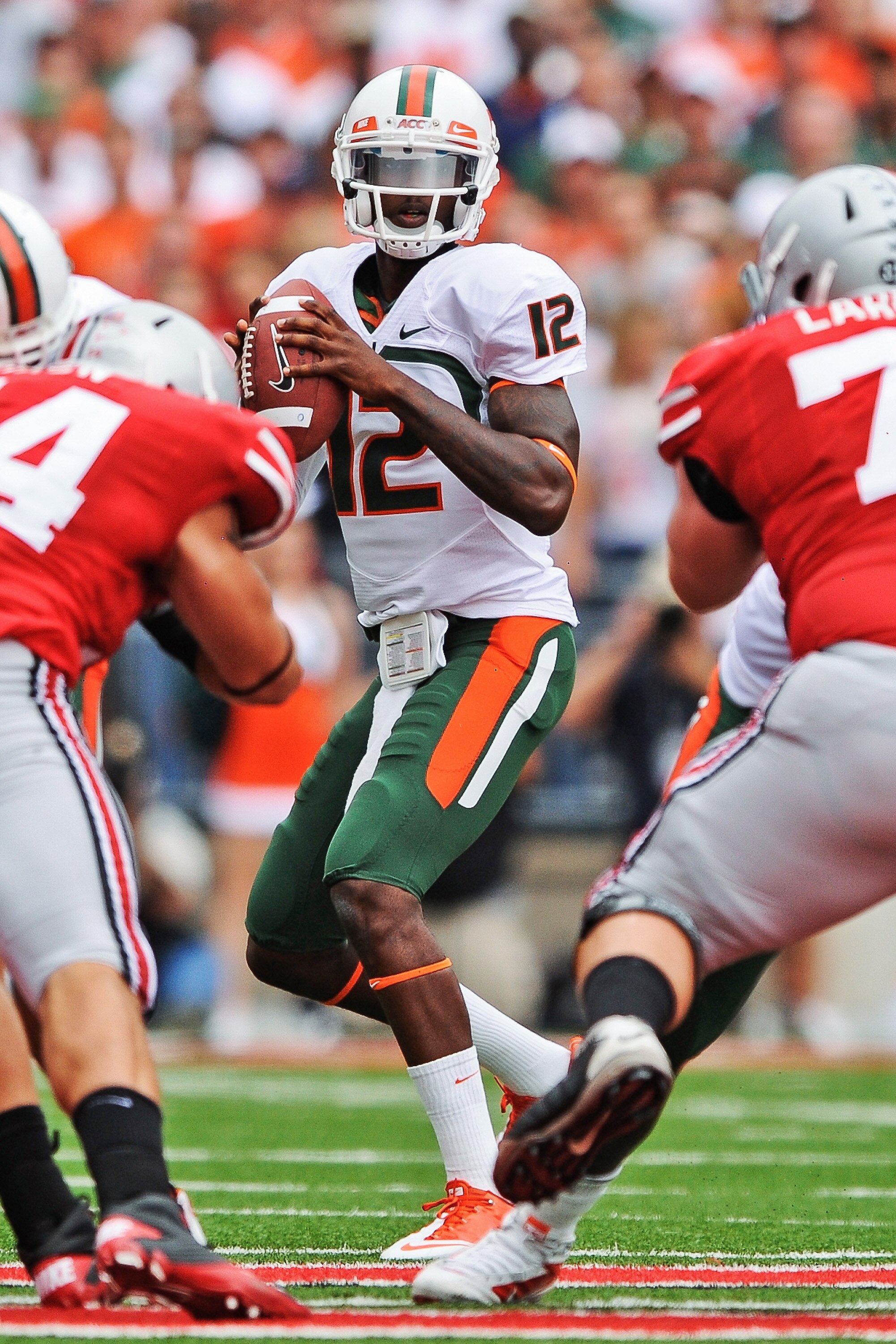 COLUMBUS, OH - SEPTEMBER 11:  Quarterback Jacory Harris #12 of the Miami Hurricanes passes the ball against the Ohio State Buckeyes at Ohio Stadium on September 11, 2010 in Columbus, Ohio.  (Photo by Jamie Sabau/Getty Images)