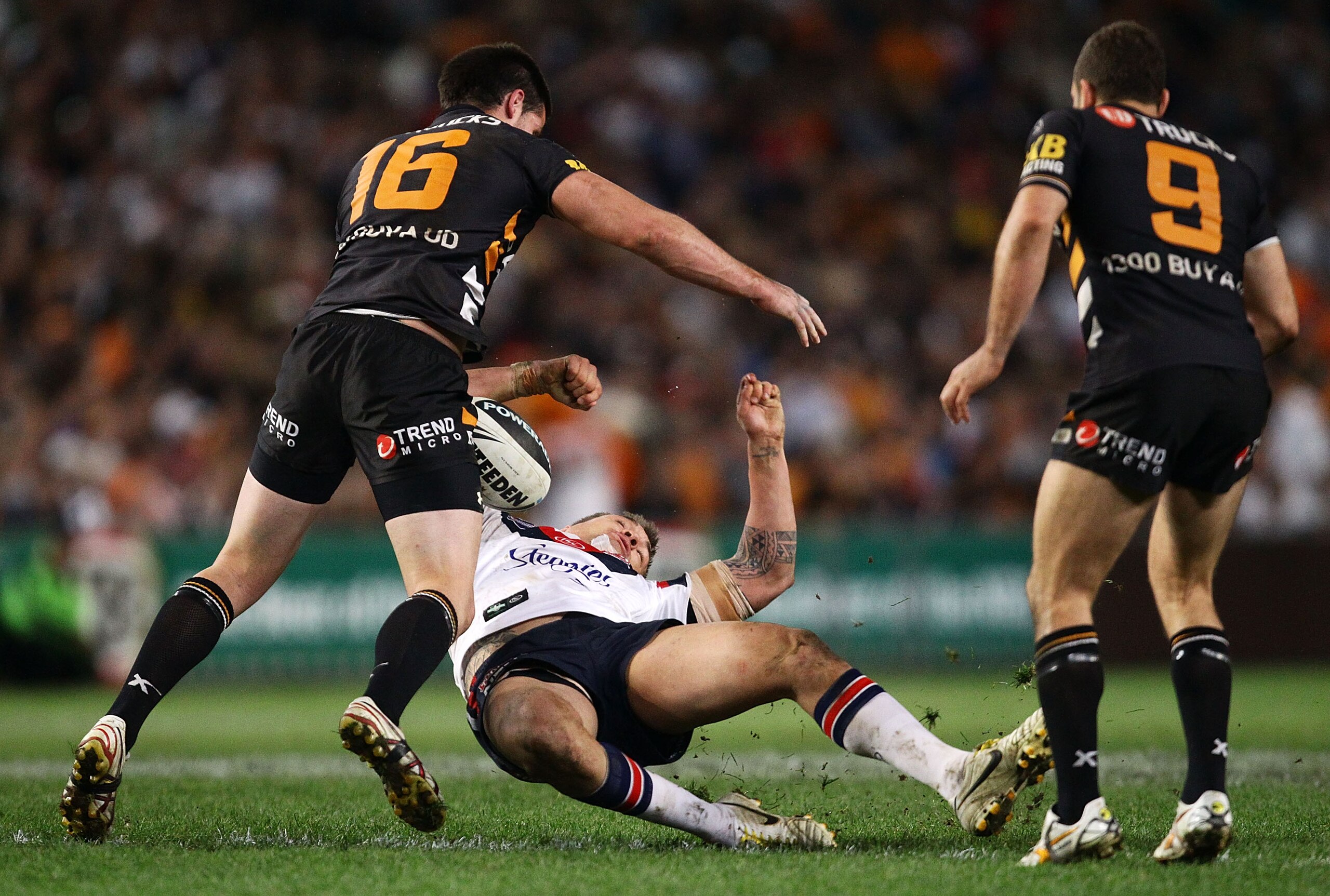 SYDNEY, AUSTRALIA - SEPTEMBER 11: Jared Waerea-Hargraves of the Roosters is hit hard in a tackle by Simon Dwyer of the Tigers in the last minute of regular time during the NRL Second Qualifying Final match between the Wests Tigers and the Sydney Roosters SYDNEY, AUSTRALIA - SEPTEMBER 11: Jared Waerea-Hargraves of the Roosters is hit hard in a tackle by Simon Dwyer of the Tigers in the last minute of regular time during the NRL Second Qualifying Final match between the Wests Tigers and the Sydney Roosters