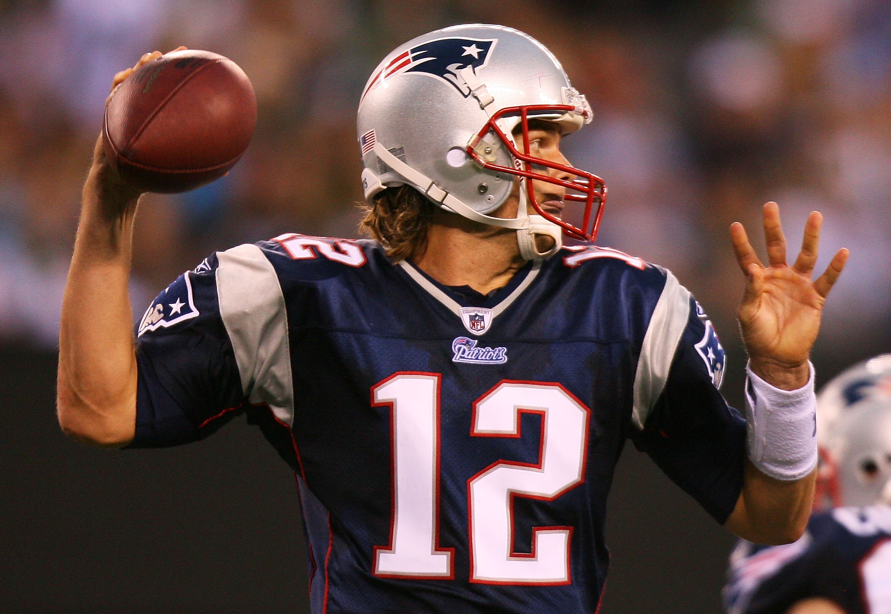 EAST RUTHERFORD, NJ - SEPTEMBER 19:  Tom Brady #12 of the New England Patriots drops back to pass against the New York Jets at the New Meadowlands Stadium on September 19, 2010 in East Rutherford, New Jersey. The Jets defeated the Patriots 28 - 14. (Photo