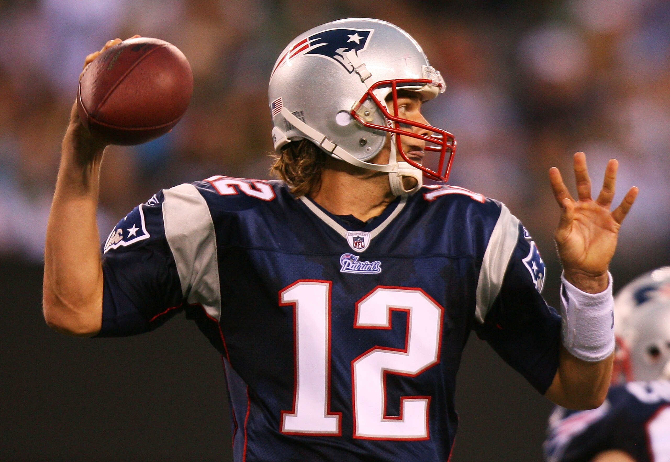 EAST RUTHERFORD, NJ - SEPTEMBER 19:  Tom Brady #12 of the New England Patriots drops back to pass against the New York Jets at the New Meadowlands Stadium on September 19, 2010 in East Rutherford, New Jersey. The Jets defeated the Patriots 28 - 14. (Photo