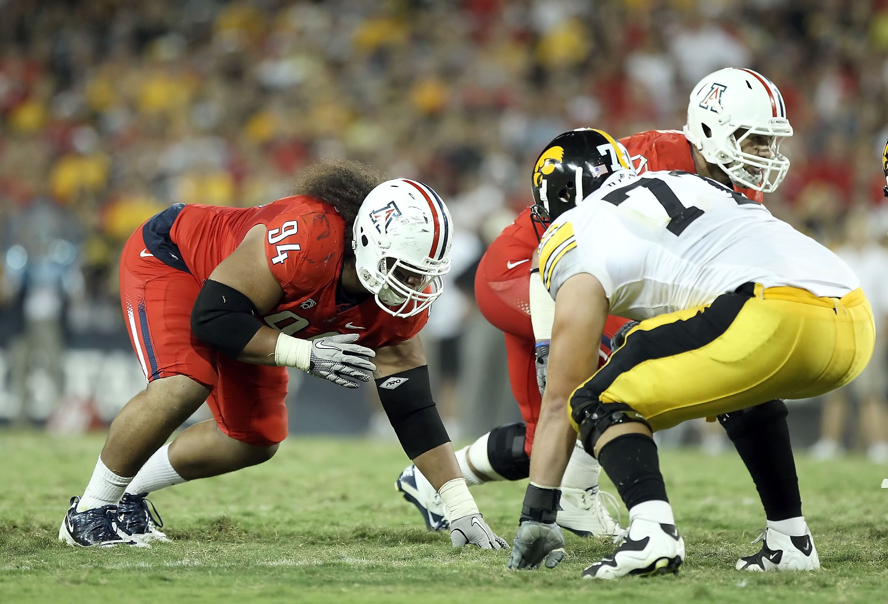 TUCSON, AZ - SEPTEMBER 18:  Defensive tackle Lolomana Mikaele #94 of the Arizona Wildcats in action during the college football game against the Iowa Hawkeyes at Arizona Stadium on September 18, 2010 in Tucson, Arizona. The Wildcats defeated the Hawkeyes 