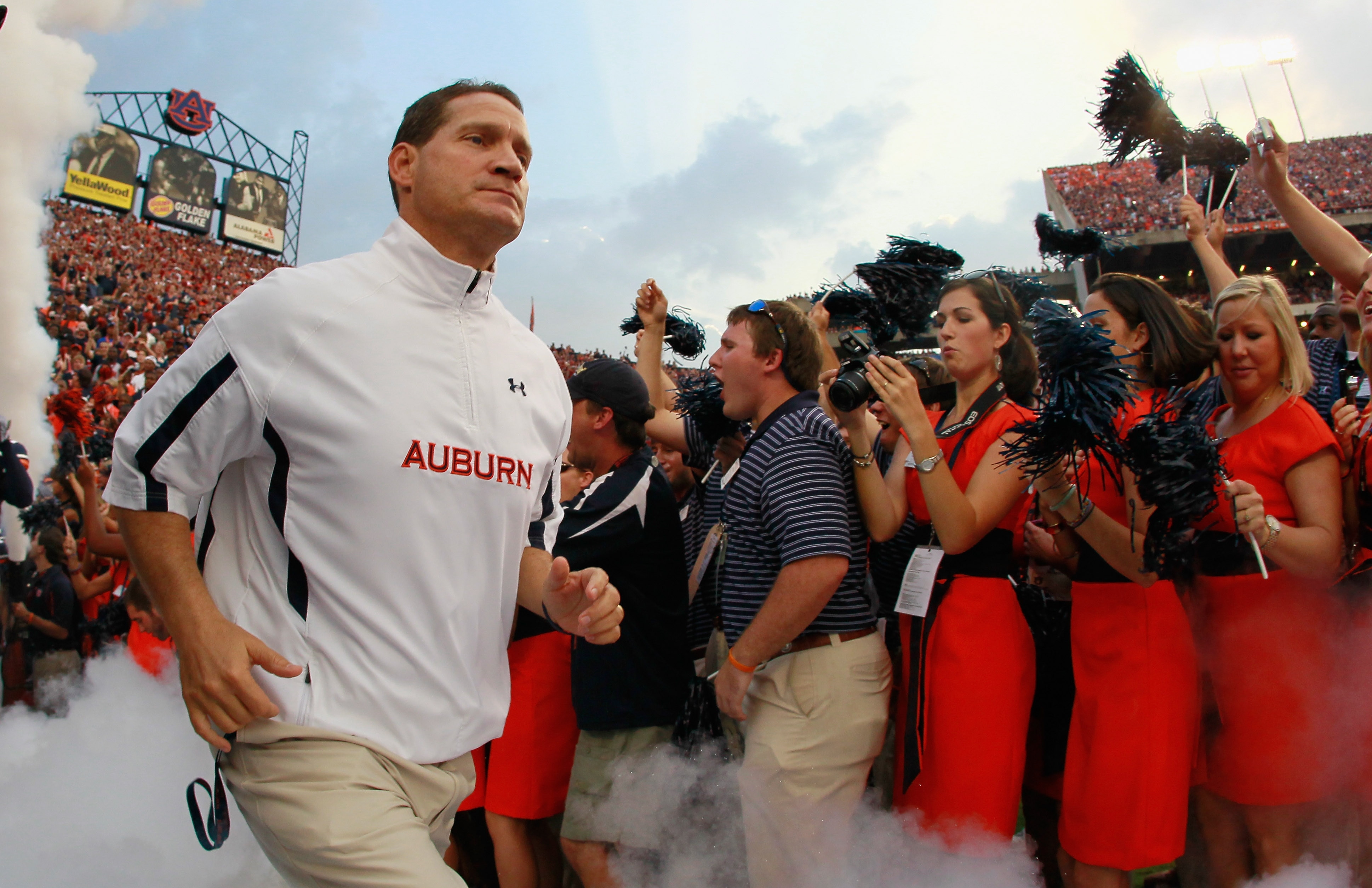 AUBURN, AL - SEPTEMBER 18: Head coach Gene Chizik of the Auburn Tigers leads his team onto the field to face the Clemson Tigers at Jordan-Hare Stadium on September 18, 2010 in Auburn, Alabama. (Photo by Kevin C. Cox/Getty Images) AUBURN, AL - SEPTEMBER 18: Head coach Gene Chizik of the Auburn Tigers leads his team onto the field to face the Clemson Tigers at Jordan-Hare Stadium on September 18, 2010 in Auburn, Alabama. (Photo by Kevin C. Cox/Getty Images)