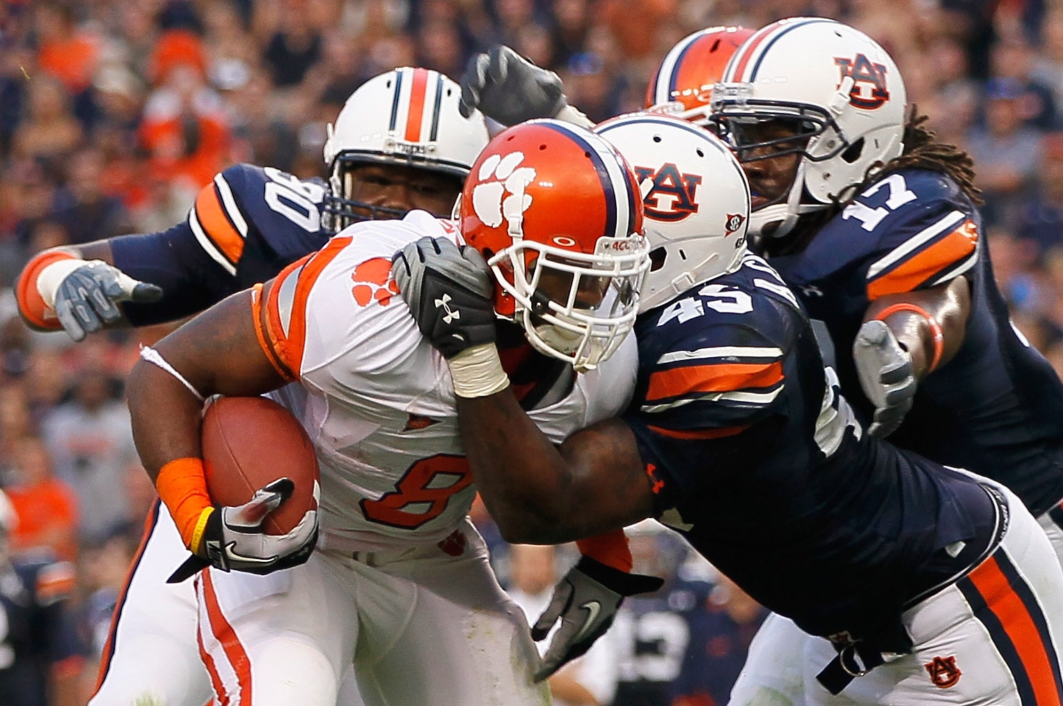 AUBURN, AL - SEPTEMBER 18: Jamie Harper #8 of the Clemson Tigers is tackled by Nick Fairley #90, Antoine Carter #45 and Josh Bynes #17 of the Auburn Tigers at Jordan-Hare Stadium on September 18, 2010 in Auburn, Alabama. (Photo by Kevin C. Cox/Getty Ima AUBURN, AL - SEPTEMBER 18: Jamie Harper #8 of the Clemson Tigers is tackled by Nick Fairley #90, Antoine Carter #45 and Josh Bynes #17 of the Auburn Tigers at Jordan-Hare Stadium on September 18, 2010 in Auburn, Alabama. (Photo by Kevin C. Cox/Getty Ima