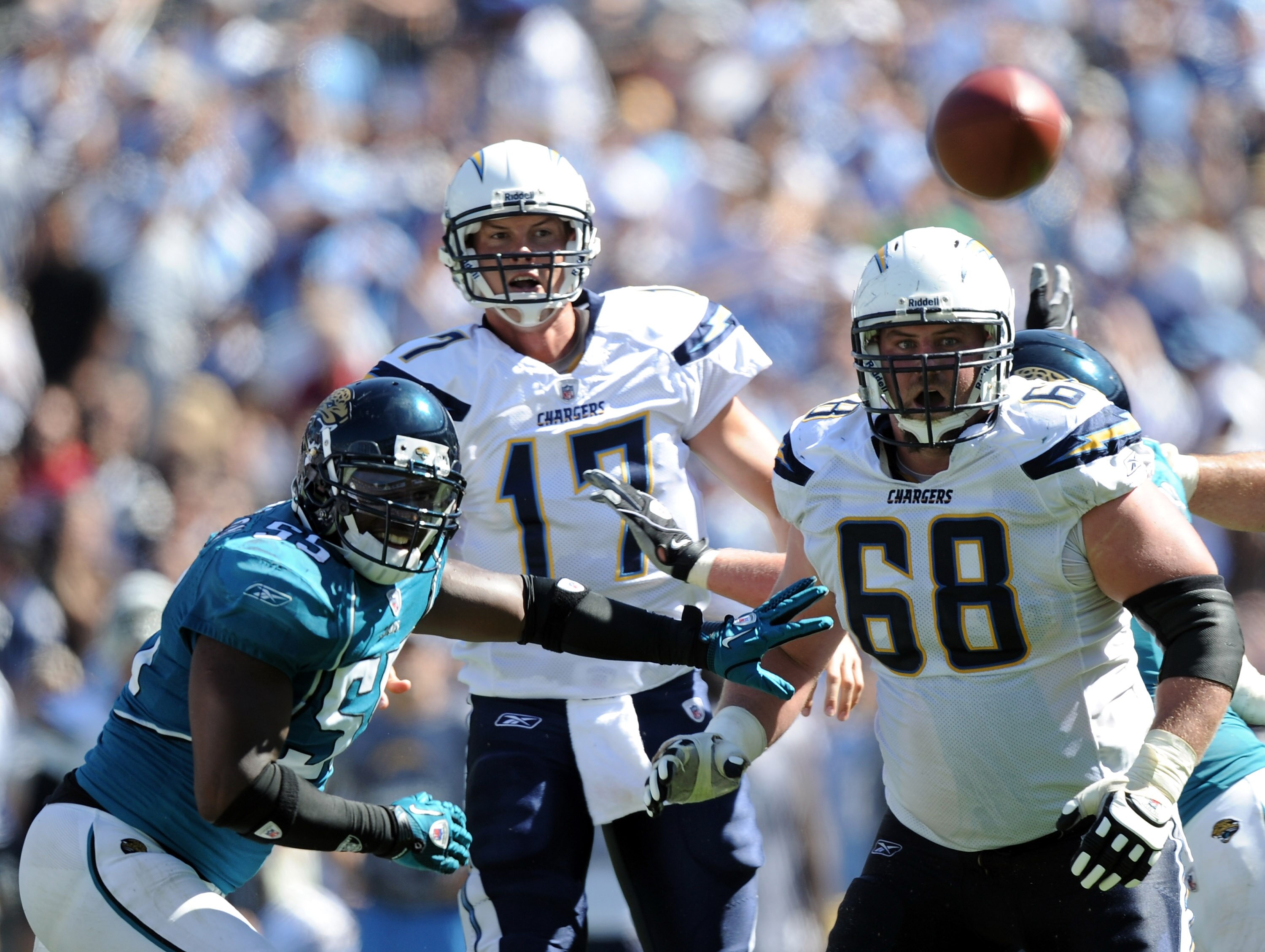 SAN DIEGO - SEPTEMBER 19:  Philip Rivers #17 of the San Diego Chargers watches his pass with Kris Dielman #68 and Kirk Morrison #55 of the Jacksonville Jaguars during the game at Qualcomm Stadium on September 19, 2010 in San Diego, California.  (Photo by 
