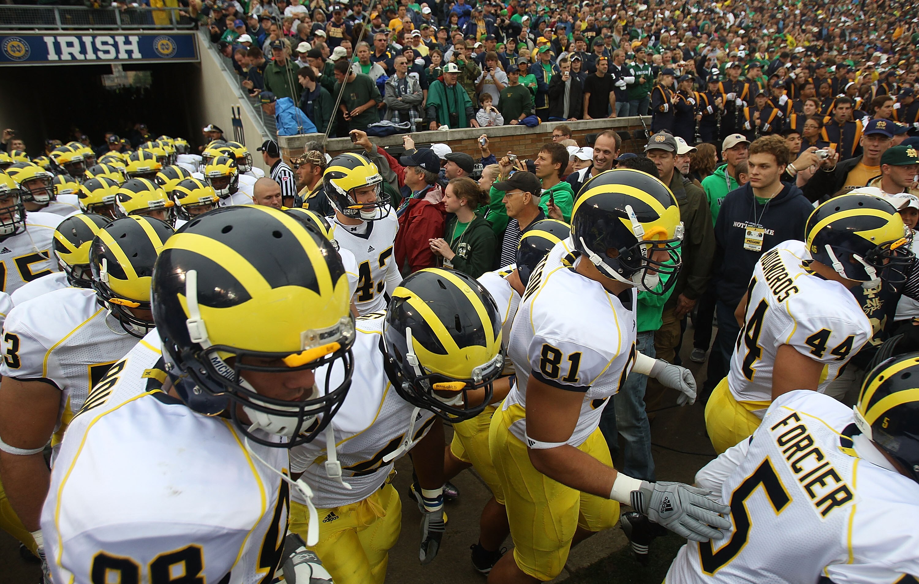 SOUTH BEND, IN - SEPTEMBER 11: Members of the Michigan Wolverines run onto the field before a game against the Notre Dame Fighting Irish at Notre Dame Stadium on September 11, 2010 in South Bend, Indiana. Michigan defeated Notre Dame 28-24. (Photo by Jona