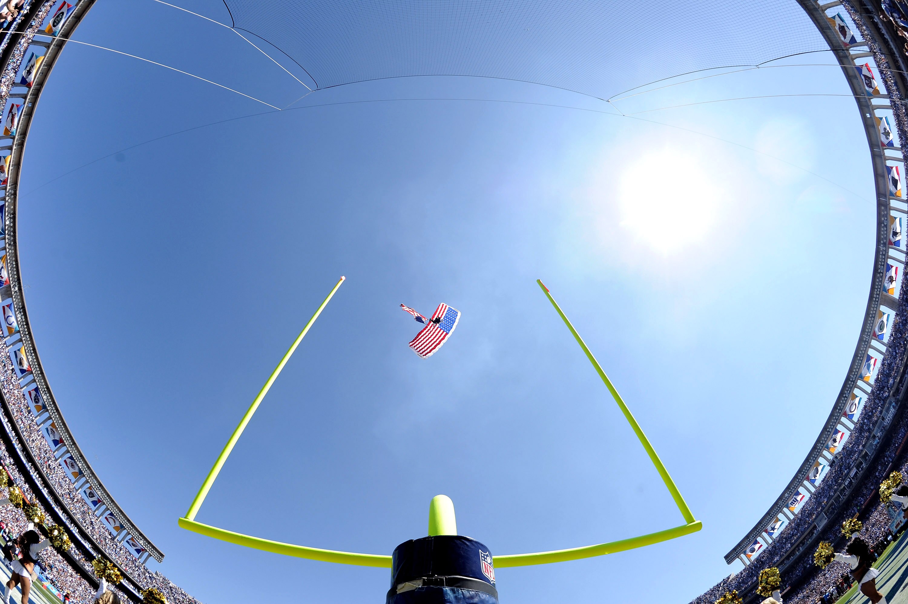 SAN DIEGO - SEPTEMBER 19: The American flag is brought into the stadium by parachutte during the national anthem before the game between the Jacksonville Jaguars and the San Diego Chargers at Qualcomm Stadium on September 19, 2010 in San Diego, Californi SAN DIEGO - SEPTEMBER 19: The American flag is brought into the stadium by parachutte during the national anthem before the game between the Jacksonville Jaguars and the San Diego Chargers at Qualcomm Stadium on September 19, 2010 in San Diego, Californi