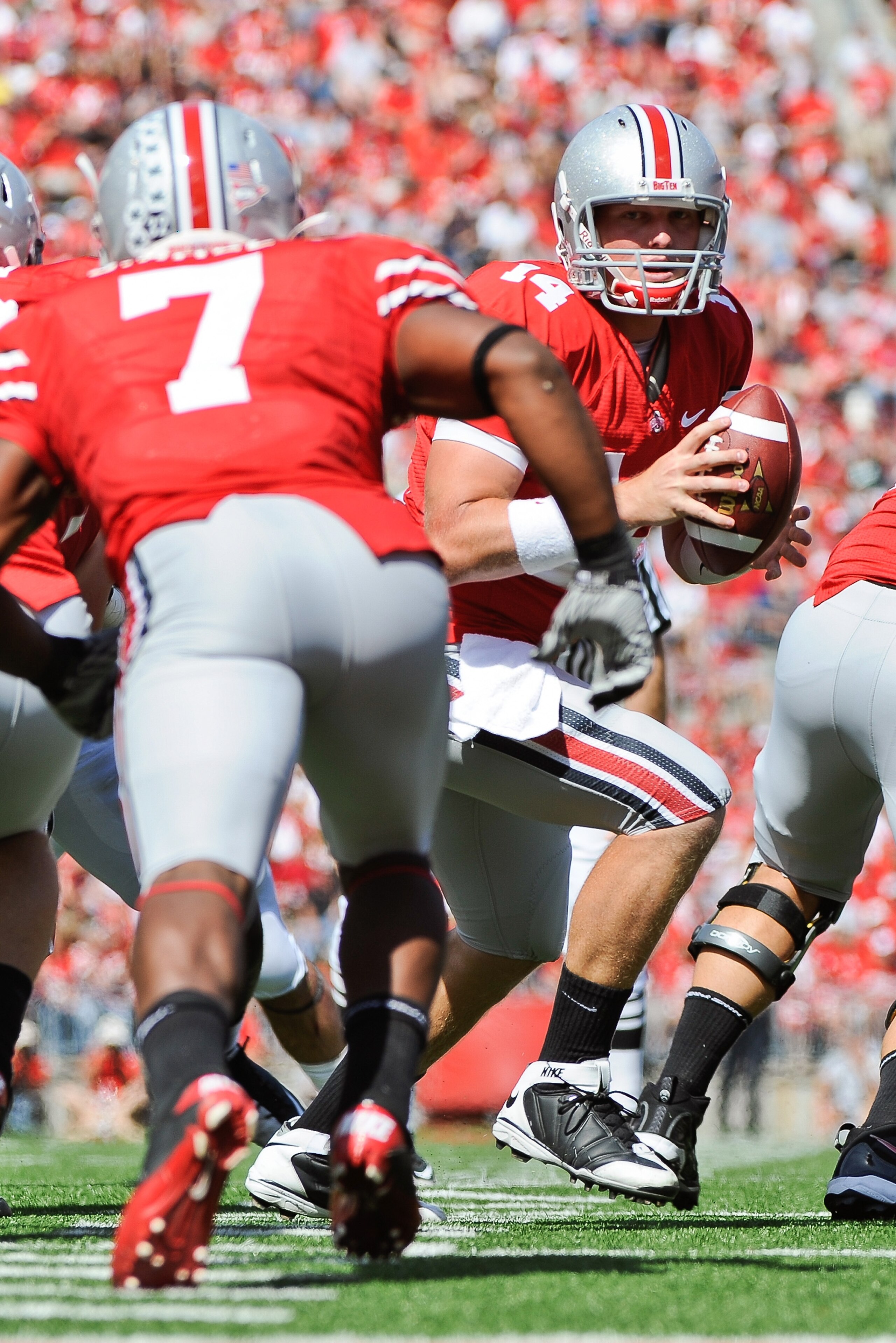 COLUMBUS, OH - SEPTEMBER 18:  Quarterback Joe Bauserman #14 of the Ohio State Buckeyes hands off the ball to Jordan Hall #7 of the Ohio State Buckeyes against the Ohio Bobcats at Ohio Stadium on September 18, 2010 in Columbus, Ohio.  (Photo by Jamie Sabau