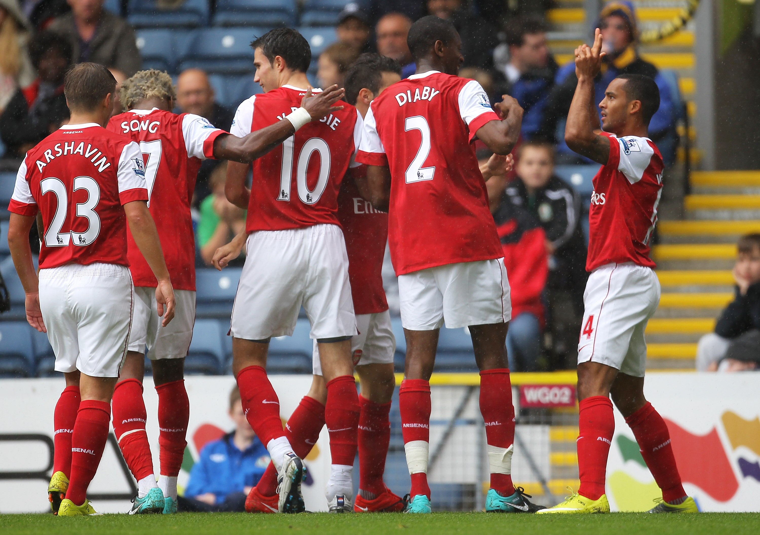 BLACKBURN, ENGLAND - AUGUST 28:  Theo Walcott of Arsenal celebrates with his team mates after scoring the opening goal during the Barclays Premier League match between Blackburn Rovers and Arsenal at Ewood Park on August 28, 2010 in Blackburn, England.  (
