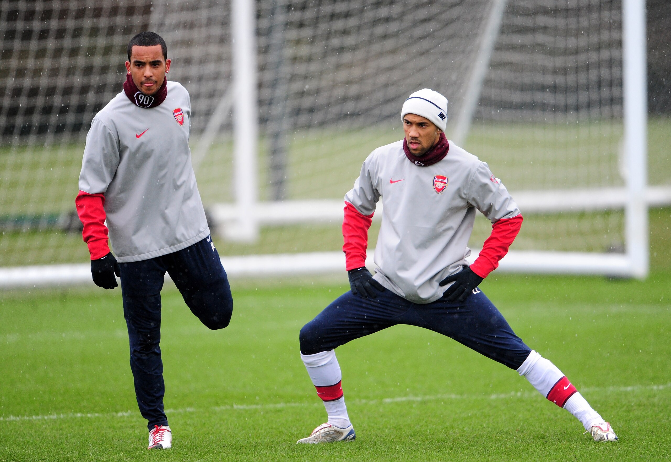 LONDON COLNEY, ENGLAND - FEBRUARY 16:  Theo Walcott and Gael Clichy of Arsenal warm up during an Arsenal training session, ahead of Wednesday's Champions League match against FC Porto, February 16, 2010 in London Colney, England.  (Photo by Mike Hewitt/Ge