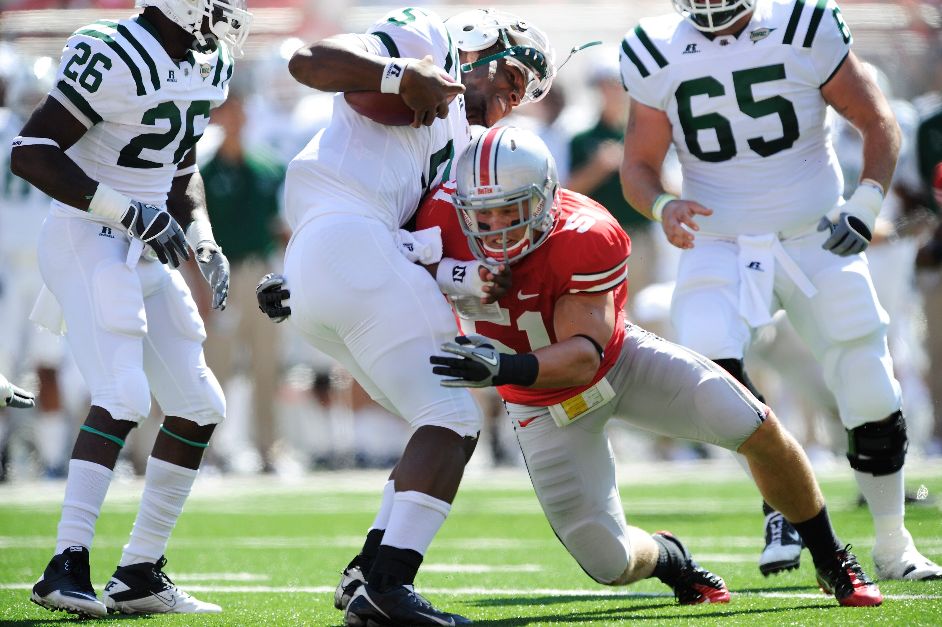 COLUMBUS, OH - SEPTEMBER 18: Ross Homan #51 of the Ohio State Buckeyes hits quarterback Phil Bates #5 of the Ohio Bobcats knocking his helmet of at Ohio Stadium on September 18, 2010 in Columbus, Ohio. (Photo by Jamie Sabau/Getty Images) COLUMBUS, OH - SEPTEMBER 18: Ross Homan #51 of the Ohio State Buckeyes hits quarterback Phil Bates #5 of the Ohio Bobcats knocking his helmet of at Ohio Stadium on September 18, 2010 in Columbus, Ohio. (Photo by Jamie Sabau/Getty Images)