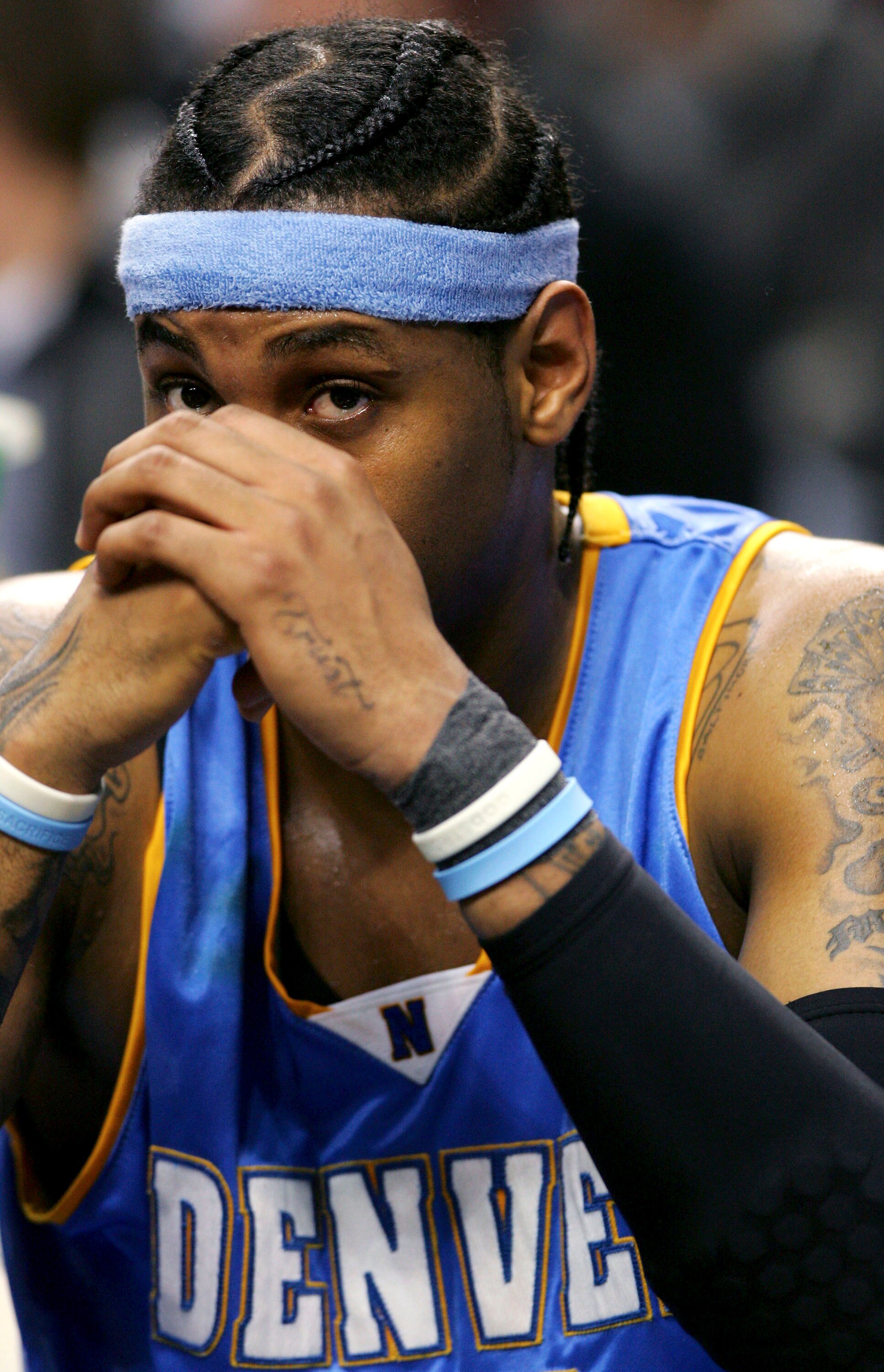 PORTLAND, OR - JANUARY 31:  Carmelo Anthony #15 of the Denver Nuggets sits on the bench against the Portland Trail Blazers on January 31, 2006 at the Rose Garden in Portland, Oregon.  NOTE TO USER: User expressly acknowledges and agrees that, by downloadi