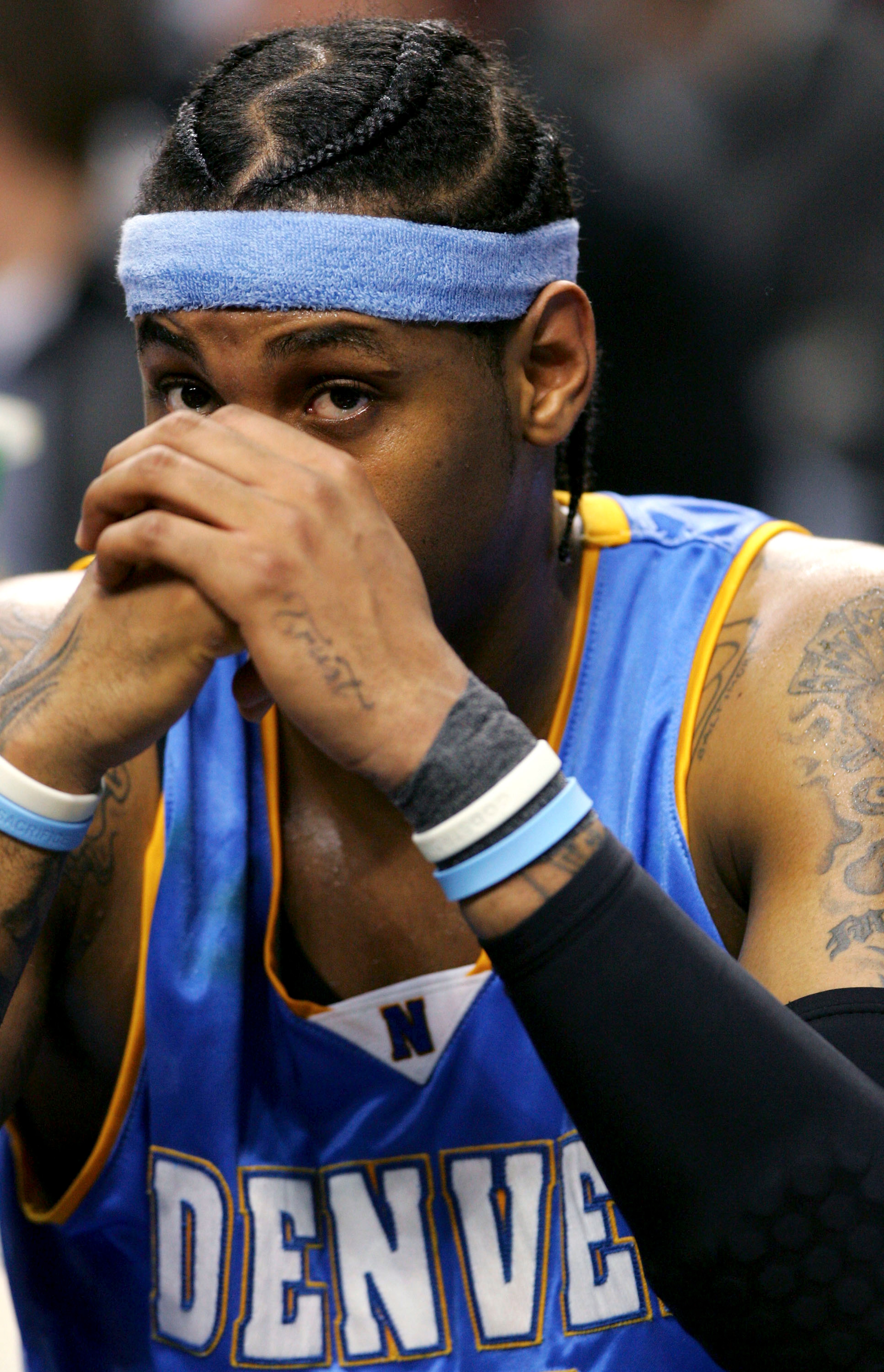 PORTLAND, OR - JANUARY 31:  Carmelo Anthony #15 of the Denver Nuggets sits on the bench against the Portland Trail Blazers on January 31, 2006 at the Rose Garden in Portland, Oregon.  NOTE TO USER: User expressly acknowledges and agrees that, by downloadi