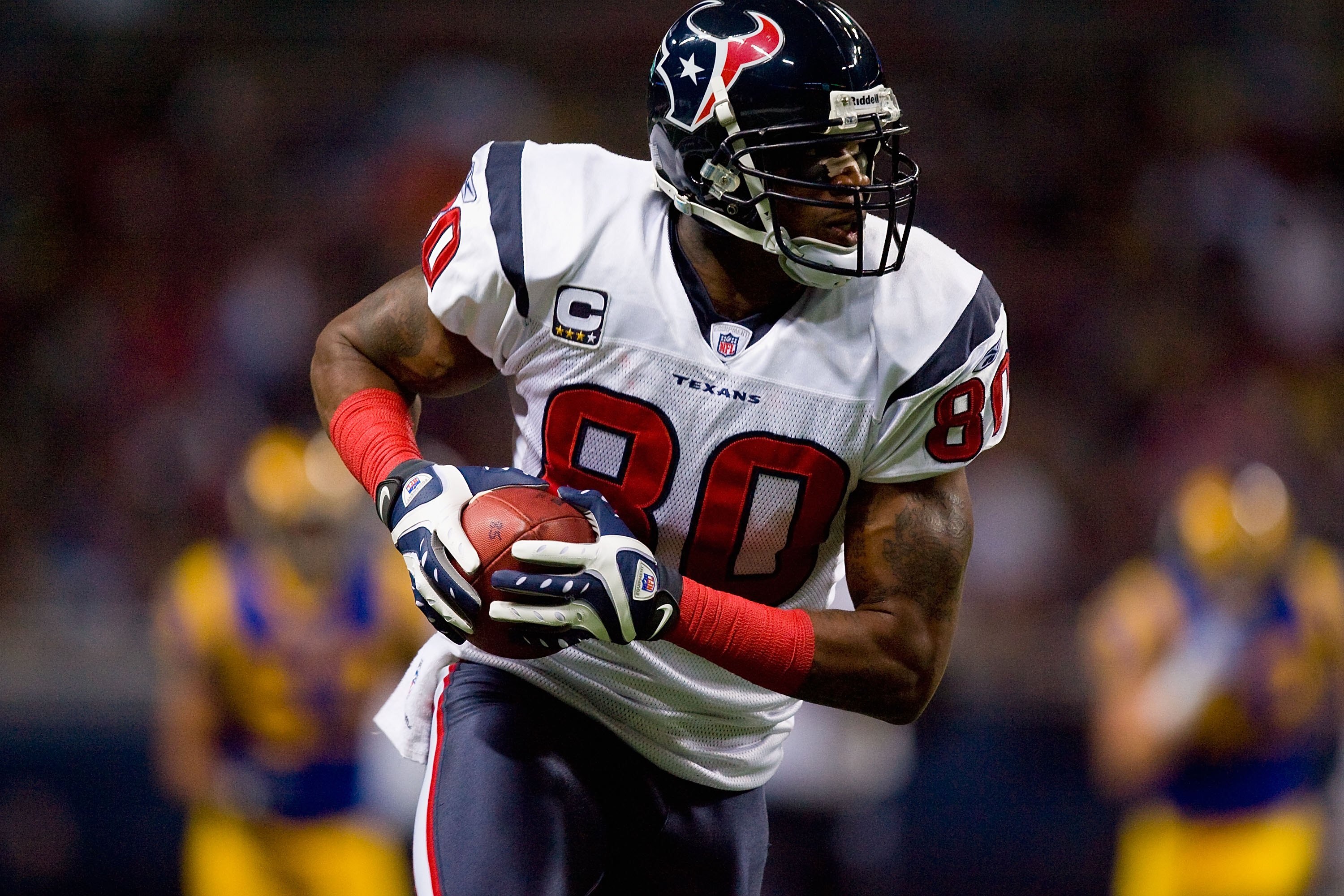 ST. LOUIS - DECEMBER 20:  Andre Johnson #80 of the Houston Texans carries the ball during the game against the St. Louis Rams at Edward Jones Dome on December 20, 2009 in St. Louis, Missouri.  (Photo by Dilip Vishwanat/Getty Images)