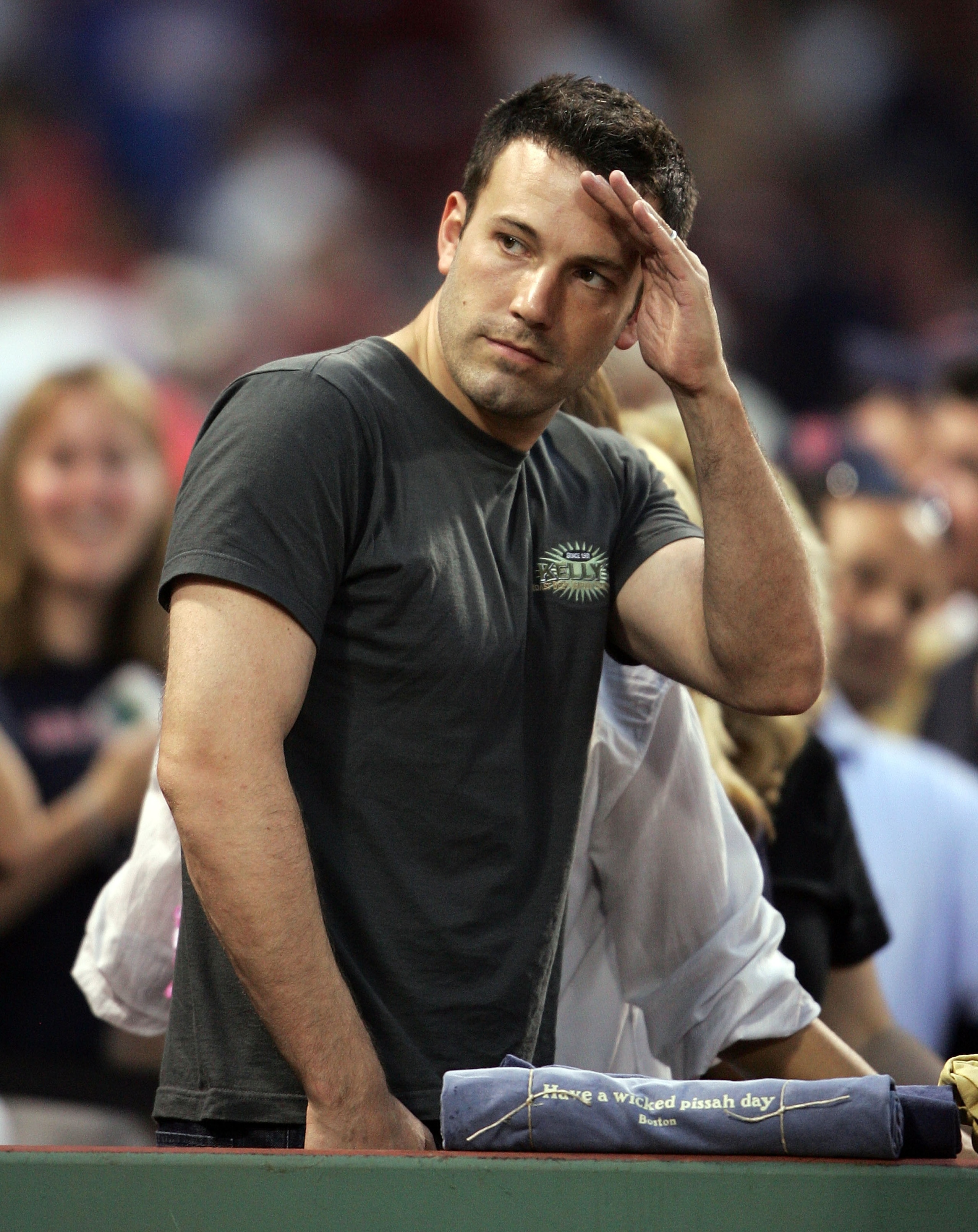 BOSTON - JUNE 02:  Actor Ben Affleck salutes a friend after Boston Red Sox defeated the New York Yankees on June 2, 2007 at Fenway Park in Boston, Massachusetts. The Red Sox defeated the Yankees 11-6.  (Photo by Elsa/Getty Images)
