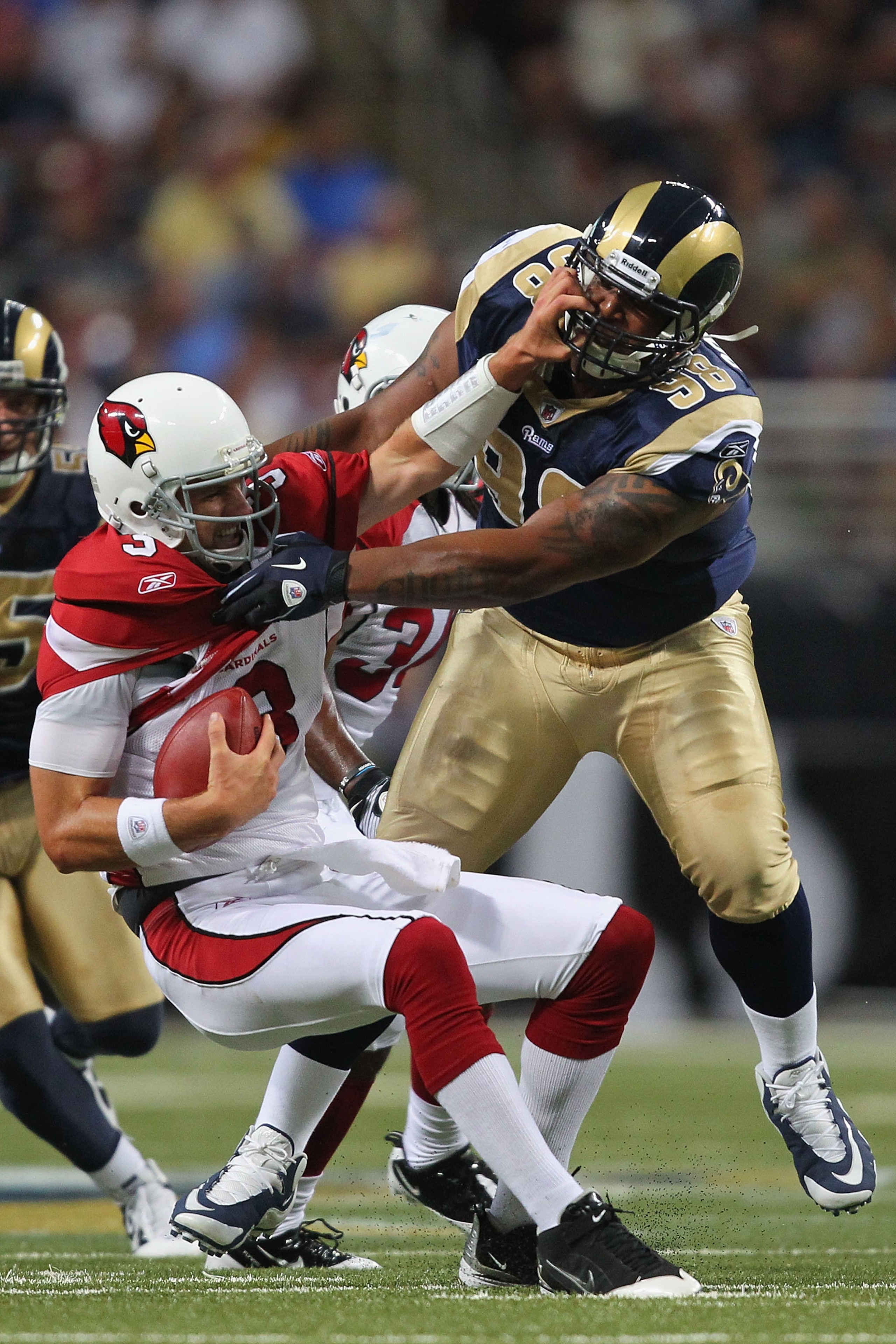 ST. LOUIS - SEPTEMBER 12: Derek Anderson #3 of the Arizona Cardinals is sacked by Fred Robbins #98 of  the St. Louis Rams during the NFL season opener at the Edward Jones Dome on September 12, 2010 in St. Louis, Missouri.  The Cardinals beat the Rams 17-1