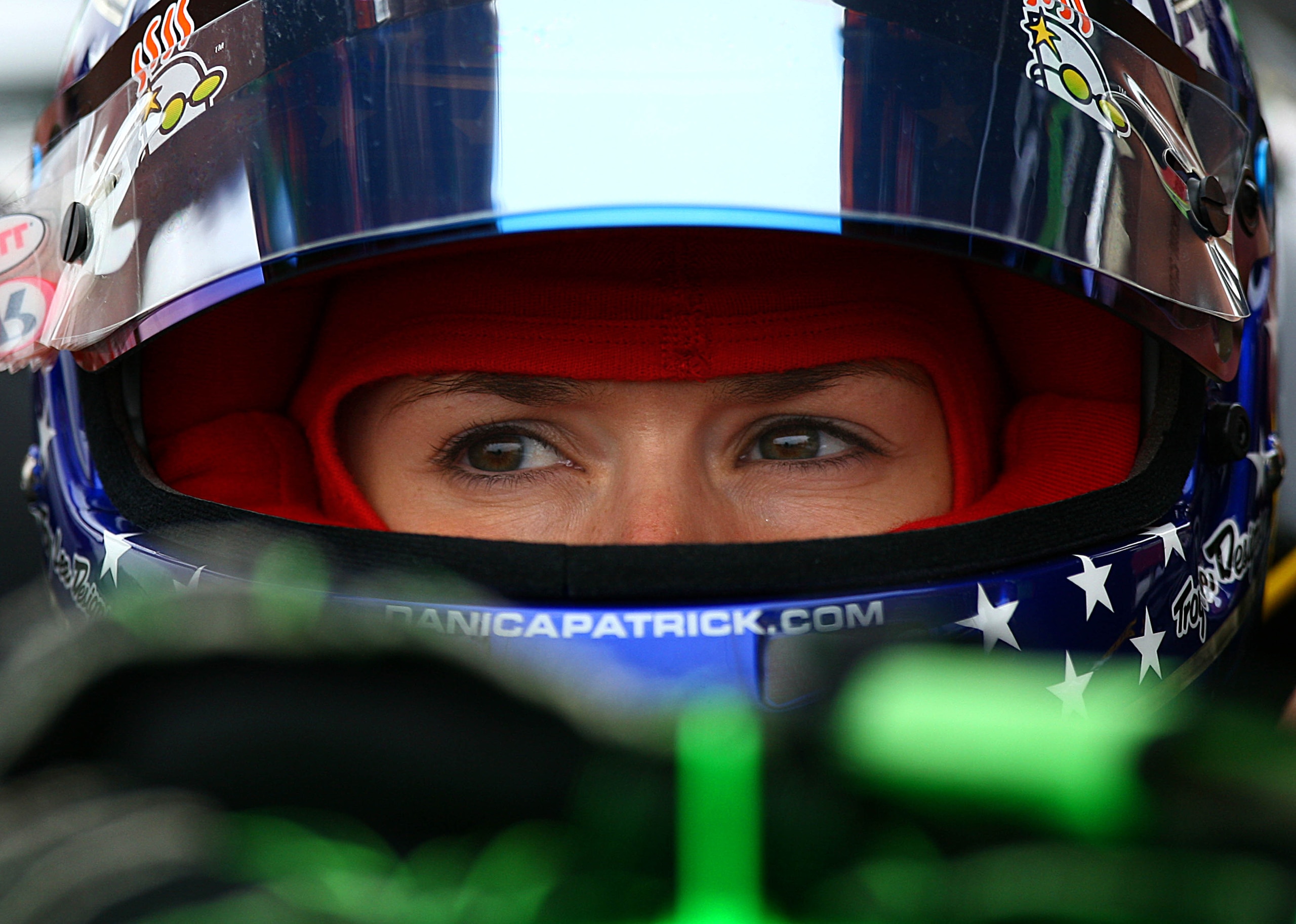 SONOMA, CA - AUGUST 21:  Danica Patrick, driver of the #7 Team GoDaddy.com Andretti Autosport Dallara Honda, looks on from the pits during practice for the IZOD IndyCar Series Grand Prix of Sonoma at Infineon Raceway on August 21, 2010 in Sonoma, Californ