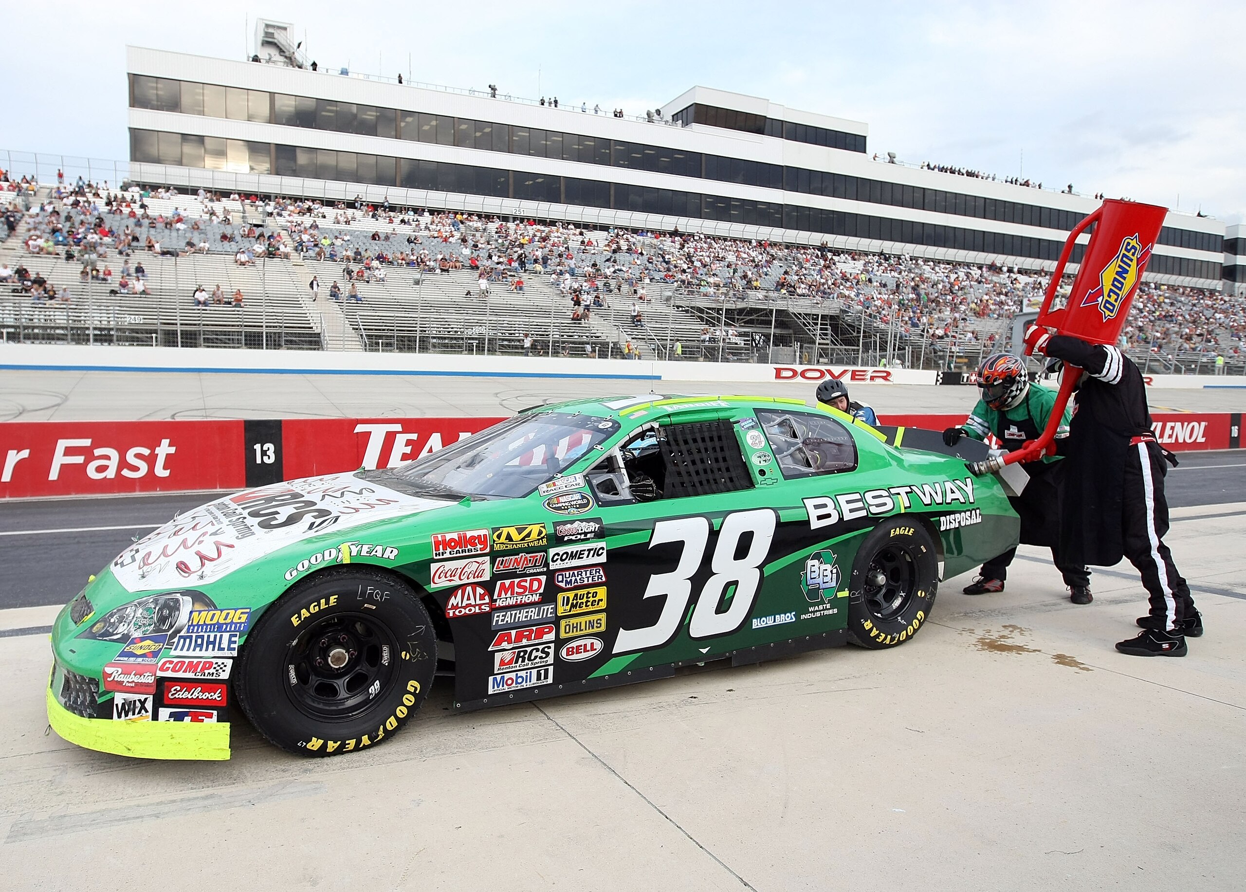 DOVER, DE - SEPTEMBER 25: Alan Tardiff, driver of the #38 Bestway Disposal/Renton Coil Spring Chevrolet makes a pit stop during the NASCAR Camping World Series East Sunoco 150 at Dover International Speedway on September 25, 2009 in Dover, Delaware.  (Pho