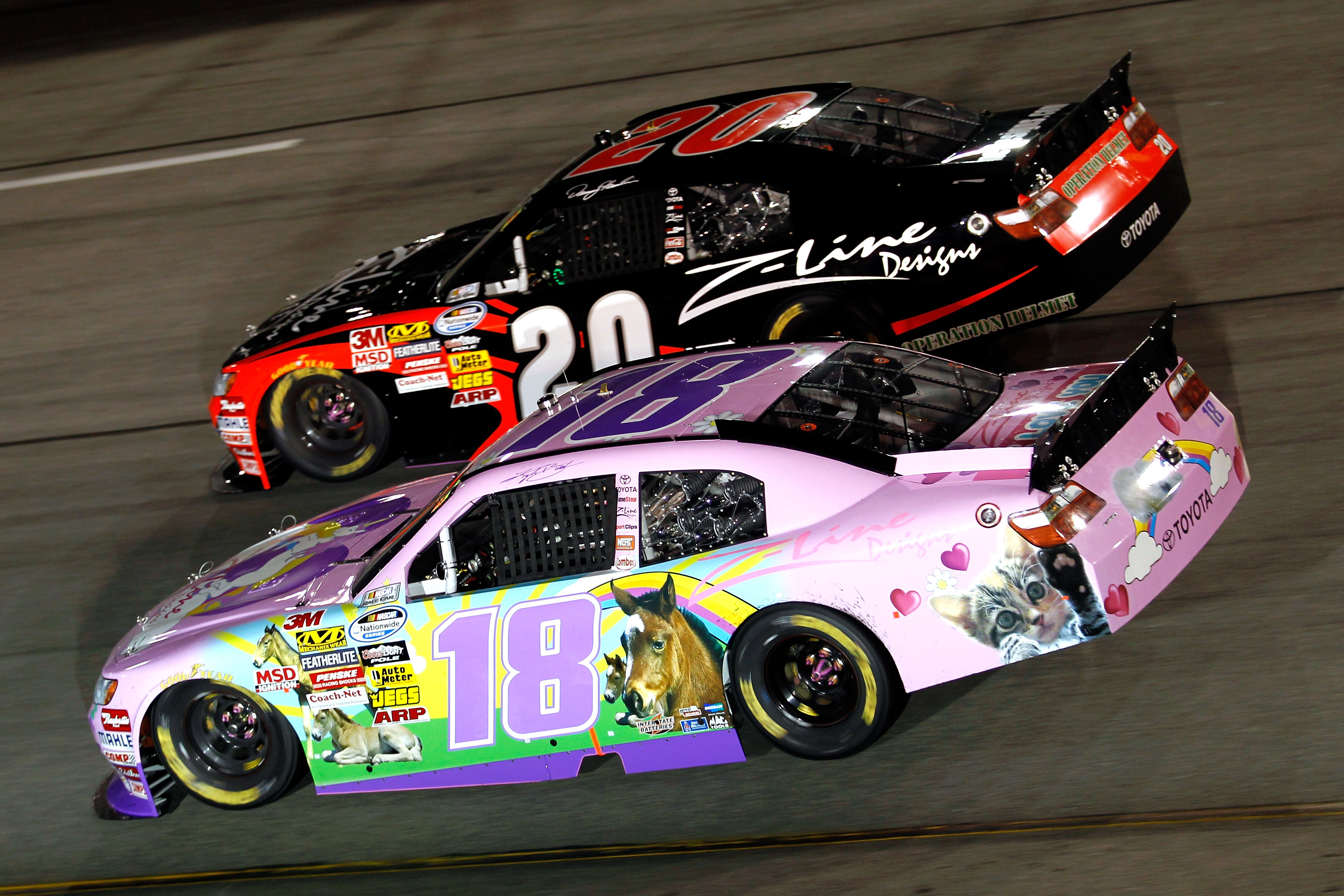 RICHMOND, VA - SEPTEMBER 10:  Kyle Busch, driver of the #18 Toyota Kimmy/Z-Line Designs Toyota, races Joey Logano, driver of the #20 Z-Line Toyota, during the NASCAR Nationwide Series Virginia 529 College Savings 250 at Richmond International Raceway on S
