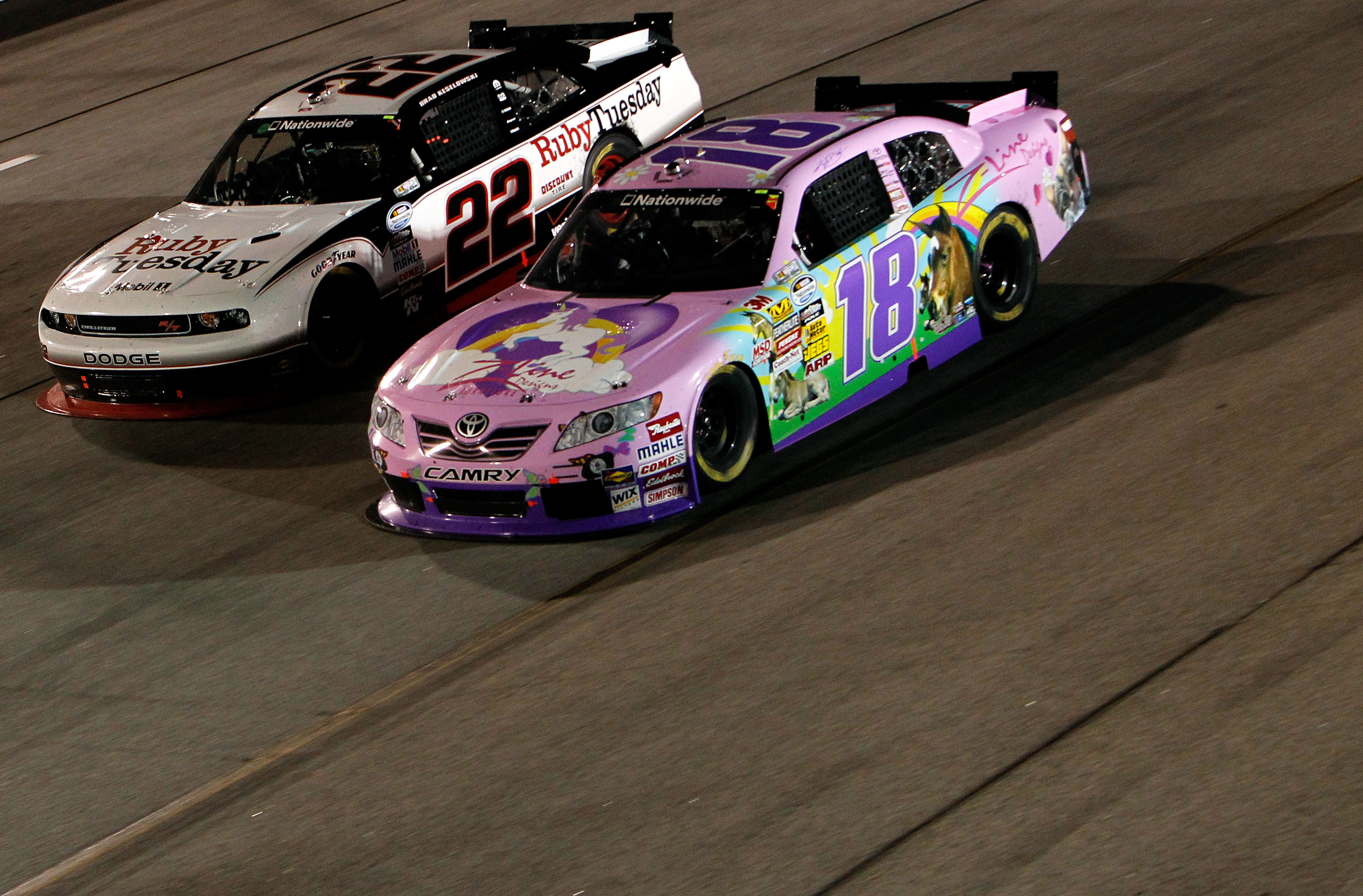 RICHMOND, VA - SEPTEMBER 10:  Kyle Busch, driver of the #18 Toyota Kimmy/Z-Line Designs Toyota, races with Brad Keselowski, driver of the #22 Ruby Tuesday Dodge, during the NASCAR Nationwide Series Virginia 529 College Savings 250 at Richmond Internationa