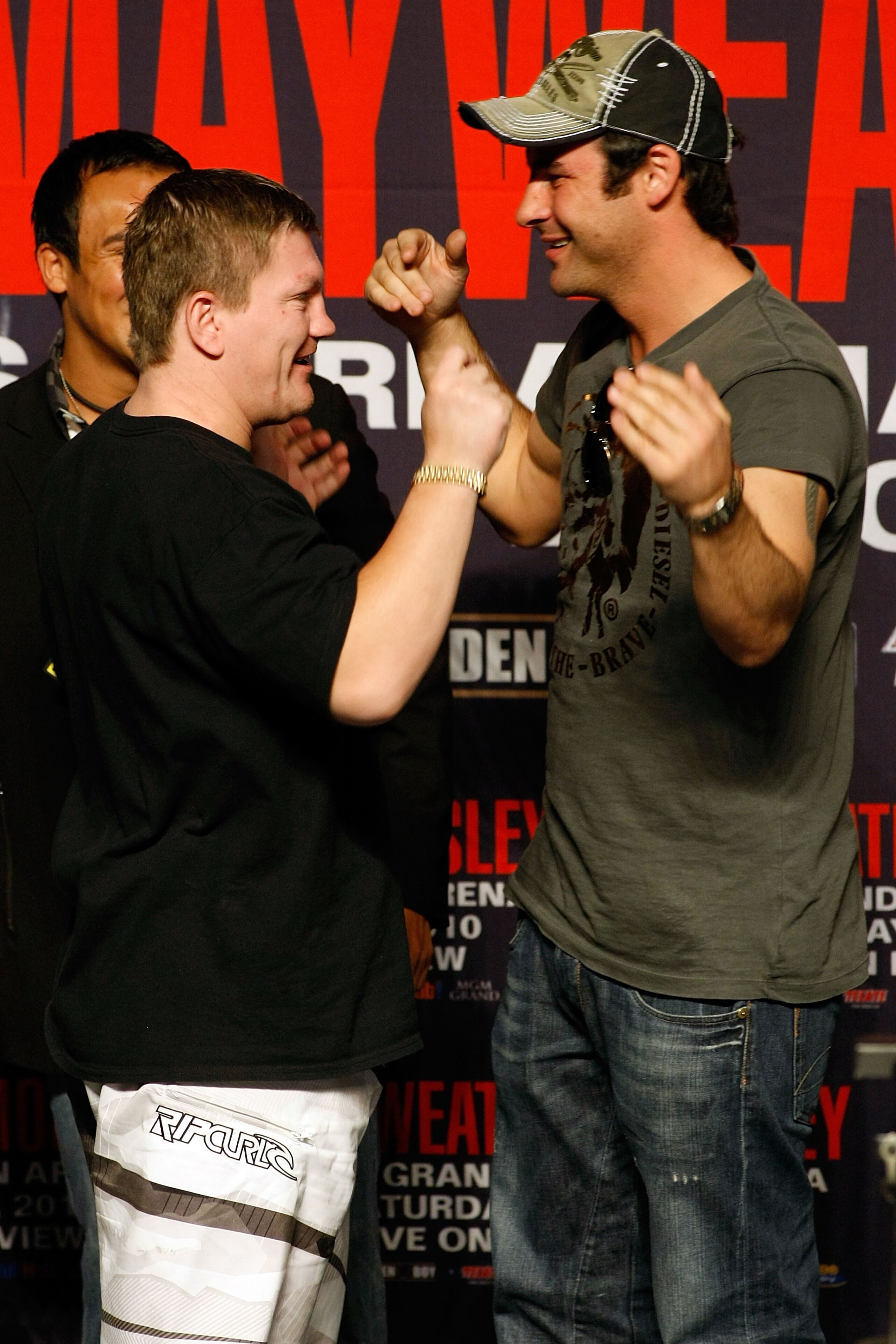 LAS VEGAS - APRIL 30:  Boxers Ricky Hatton of Great Britain and Joe Calzaghe of Wales greet each other from the stage before the start of the Floyd Mayweather Jr. and Shane Mosley weigh-in at the MGM Grand Garden Arena on April 30, 2010 in Las Vegas, Neva