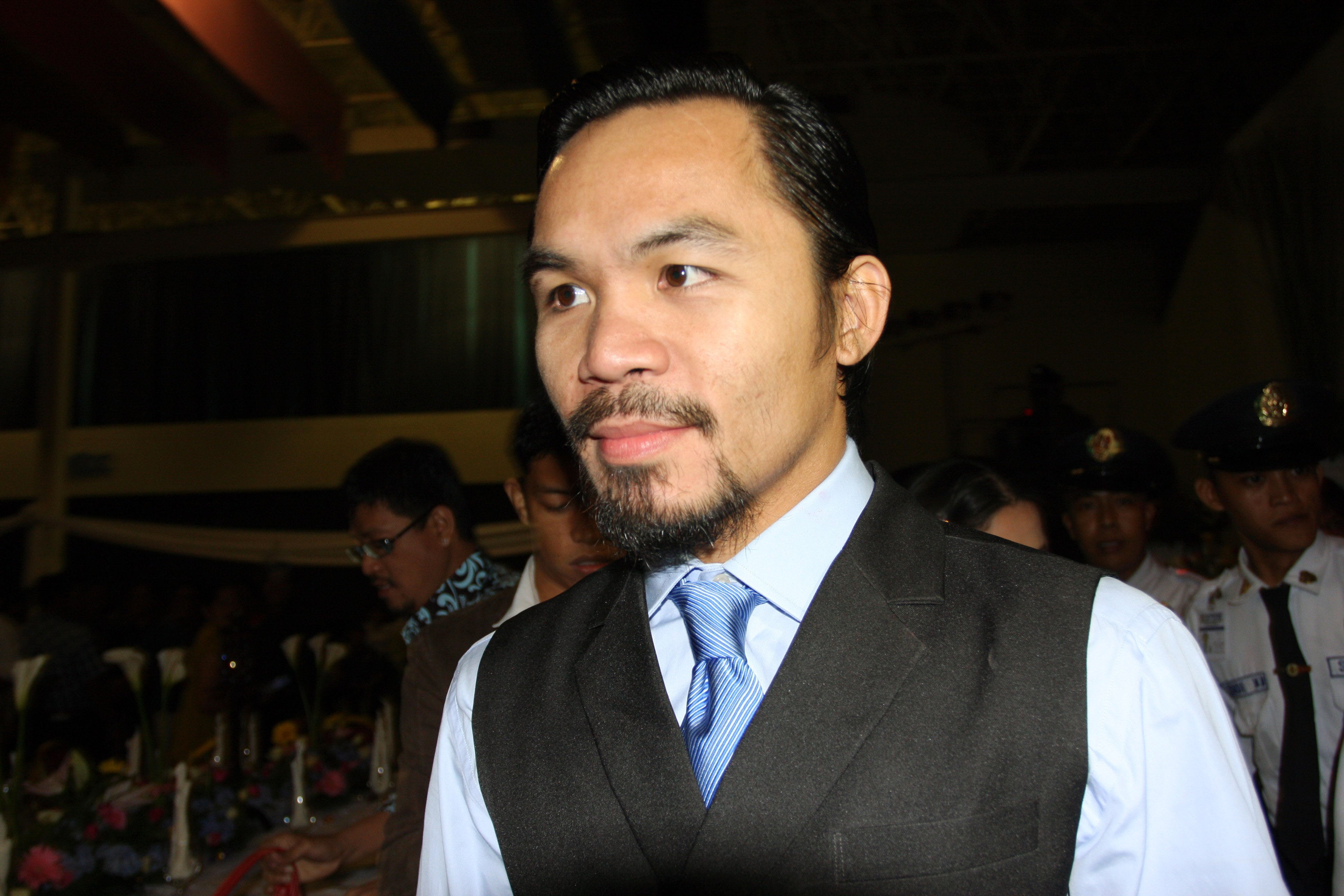GENERAL SANTOS, PHILIPPINES - MAY 15:  World welterweight boxing champion Manny Pacquiao arrives at the KCC Mall on May 15, 2010 in General Santos, Philippines. Pacquiao was there to celebrate his election on becoming a member of House of Representatives